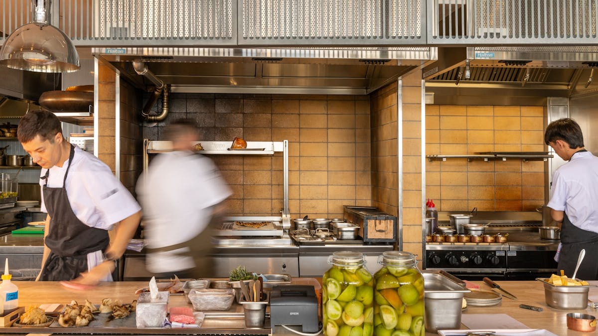 Chefs working in the open kitchen at Aloria