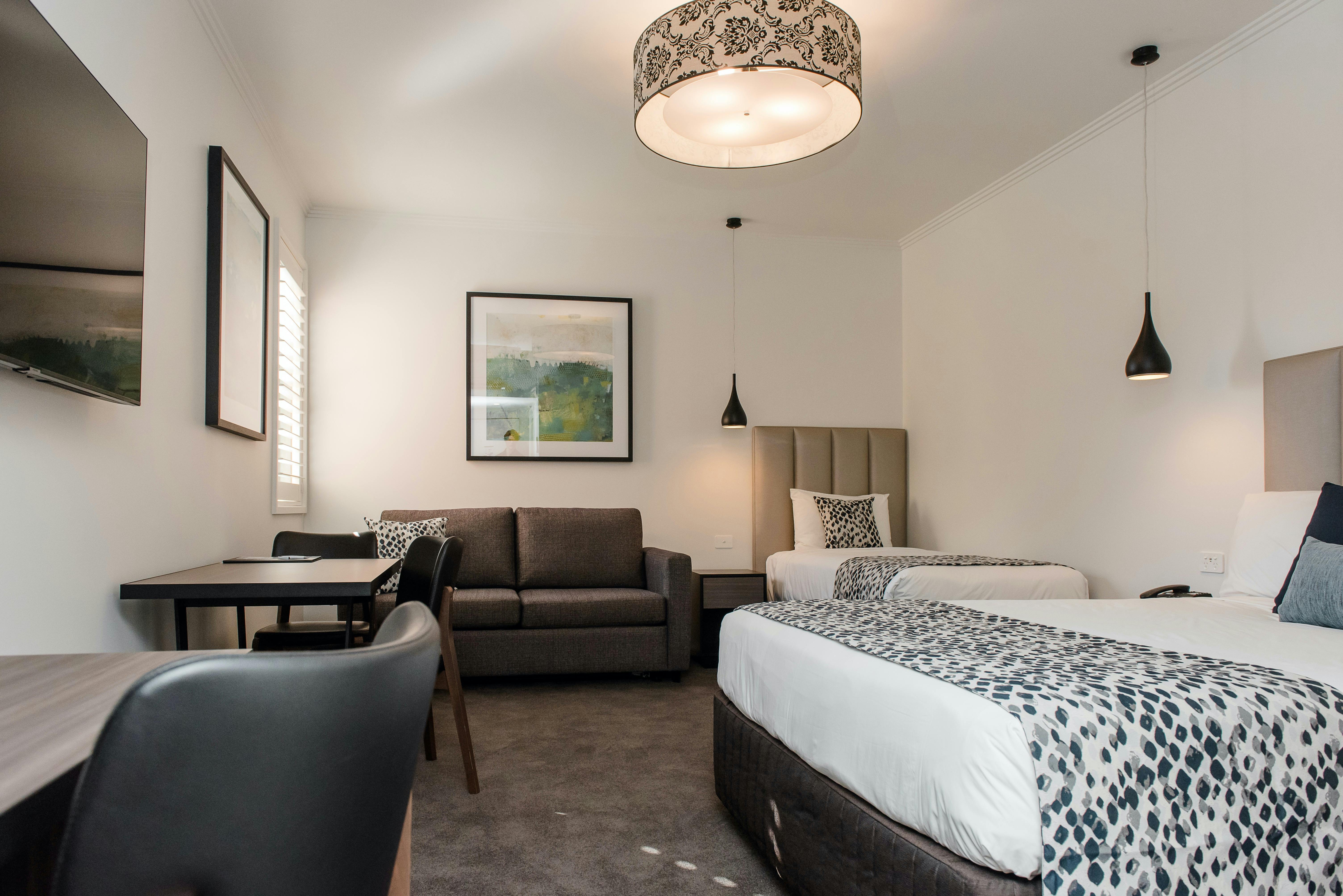 Renovated modern family suite offering queen, single and sofa bed