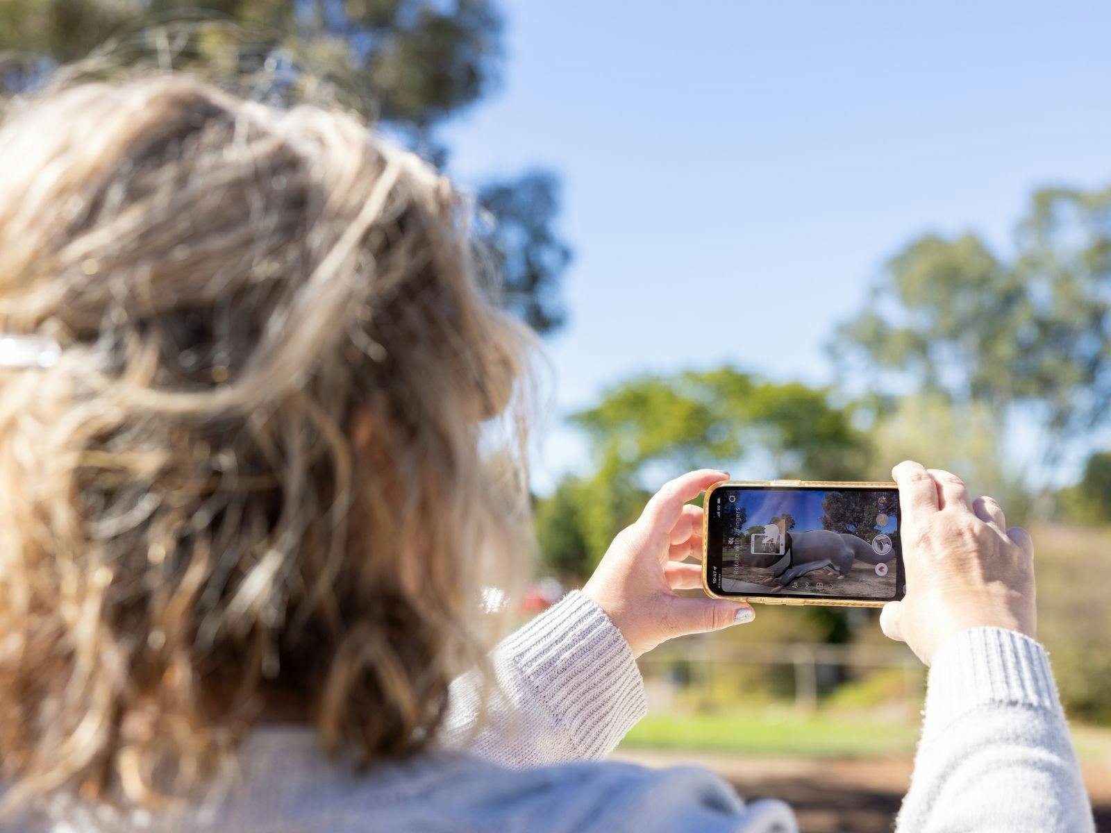 Person using photo to see AR trail