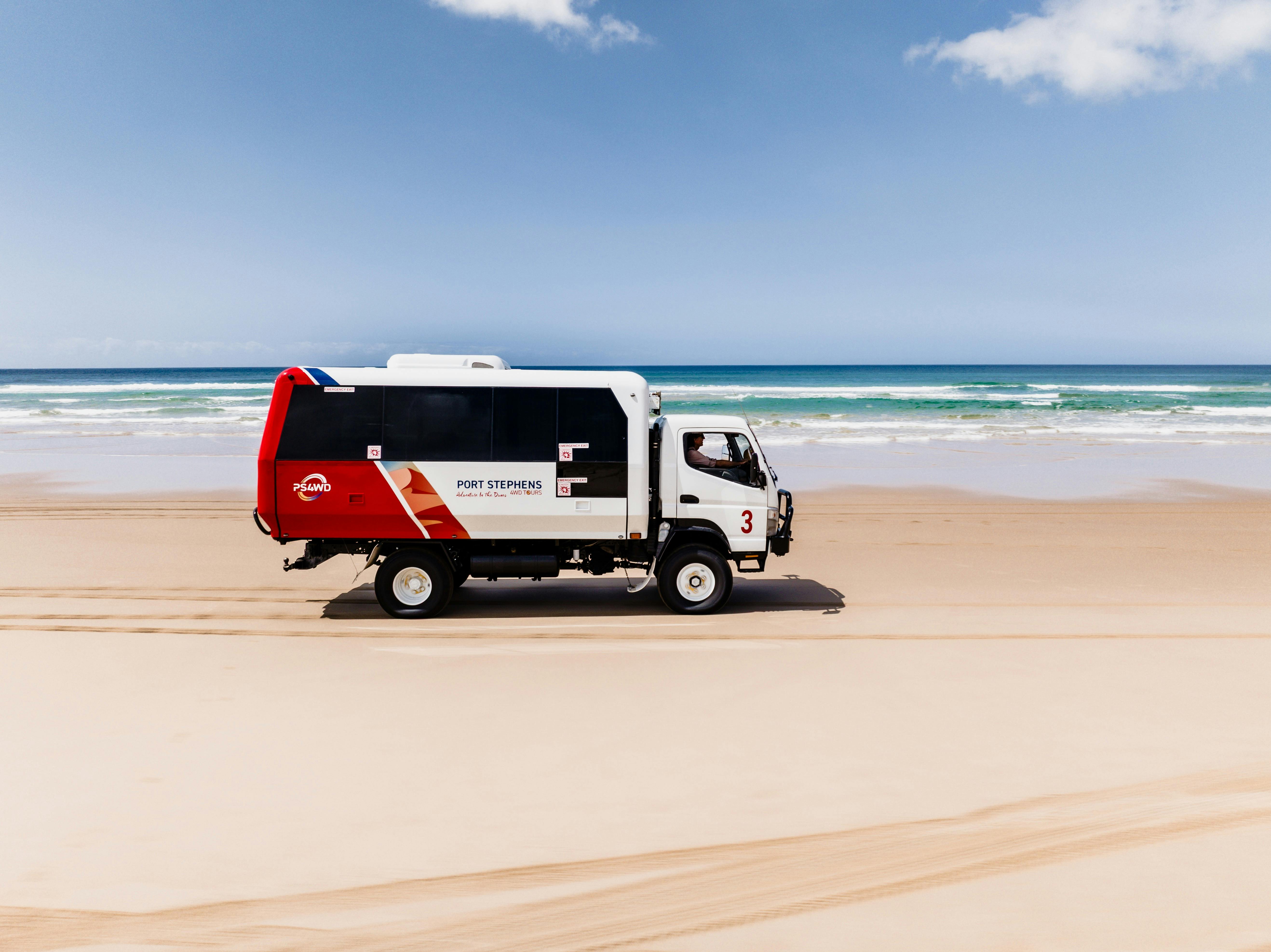 4WD Vehicle driving along beach
