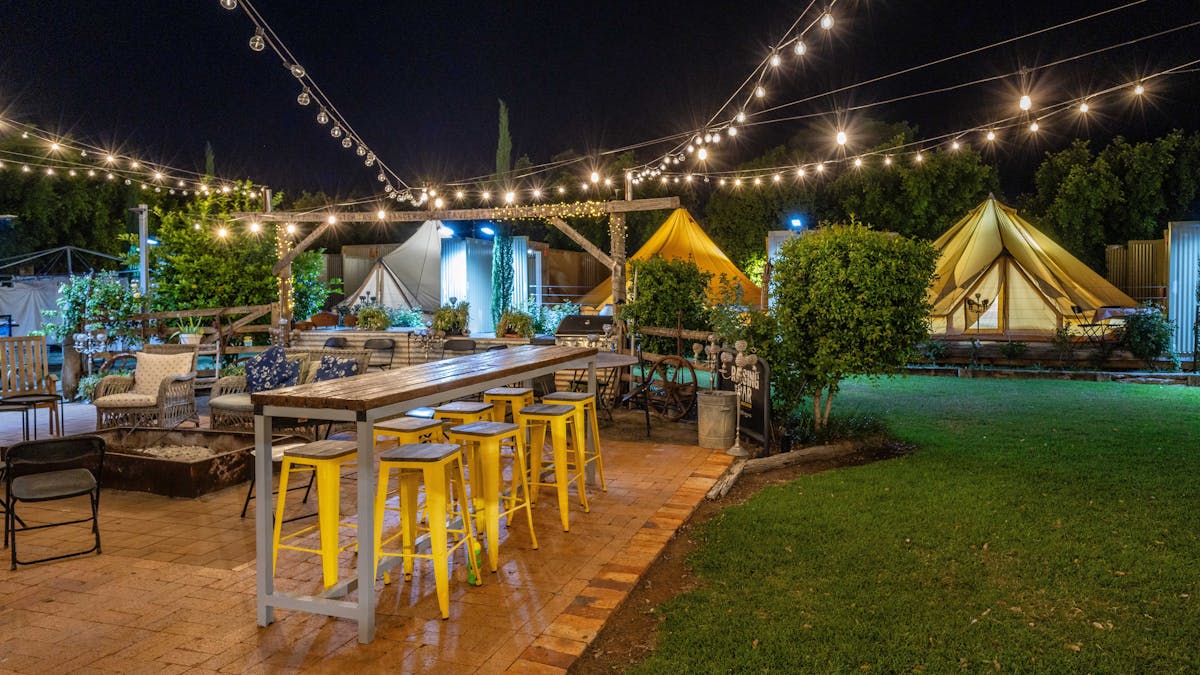 View of glamping tents in the garden setting