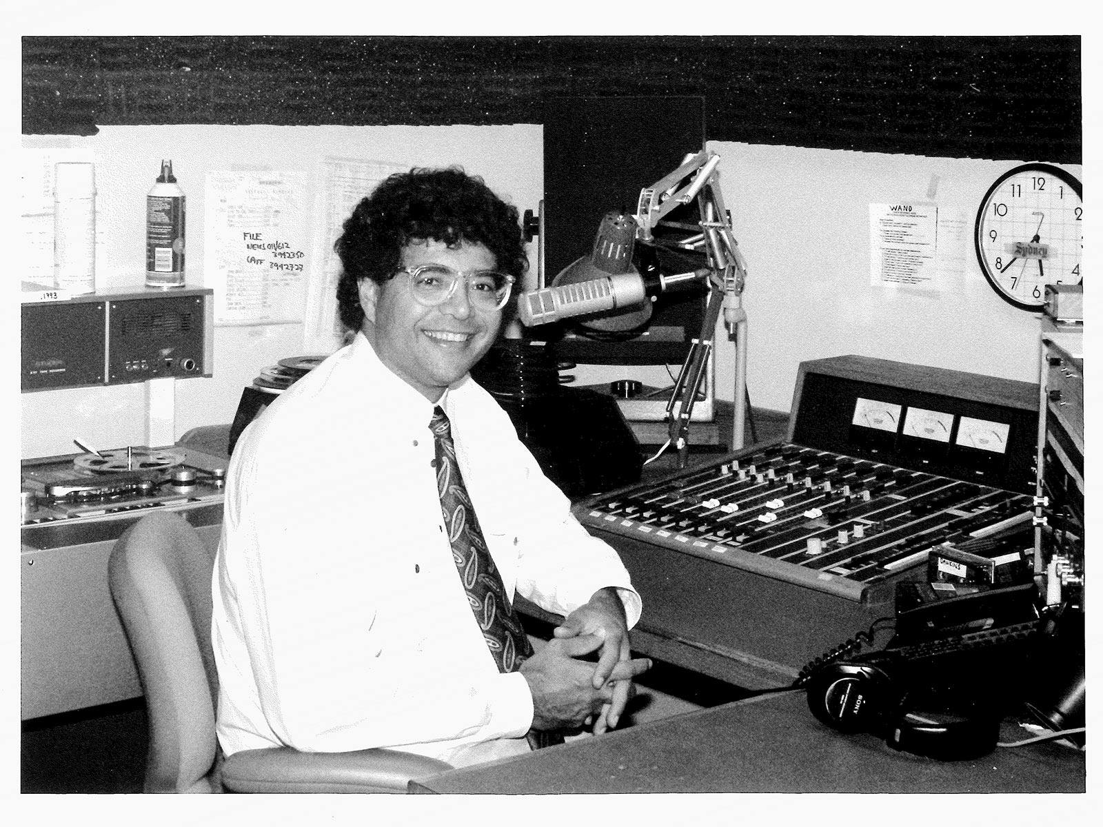Man with glasses, white shirt and tie in recording studio Man with glasses, white shirt and tie in recording studio
