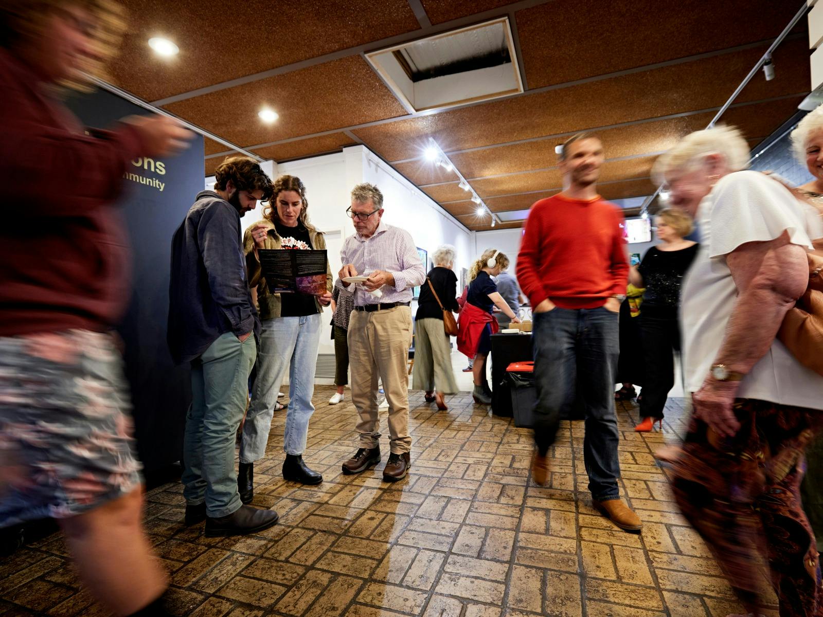 A crowd at the 2024 Season Launch enjoying refreshments in the foyer and inspecting the new brochure