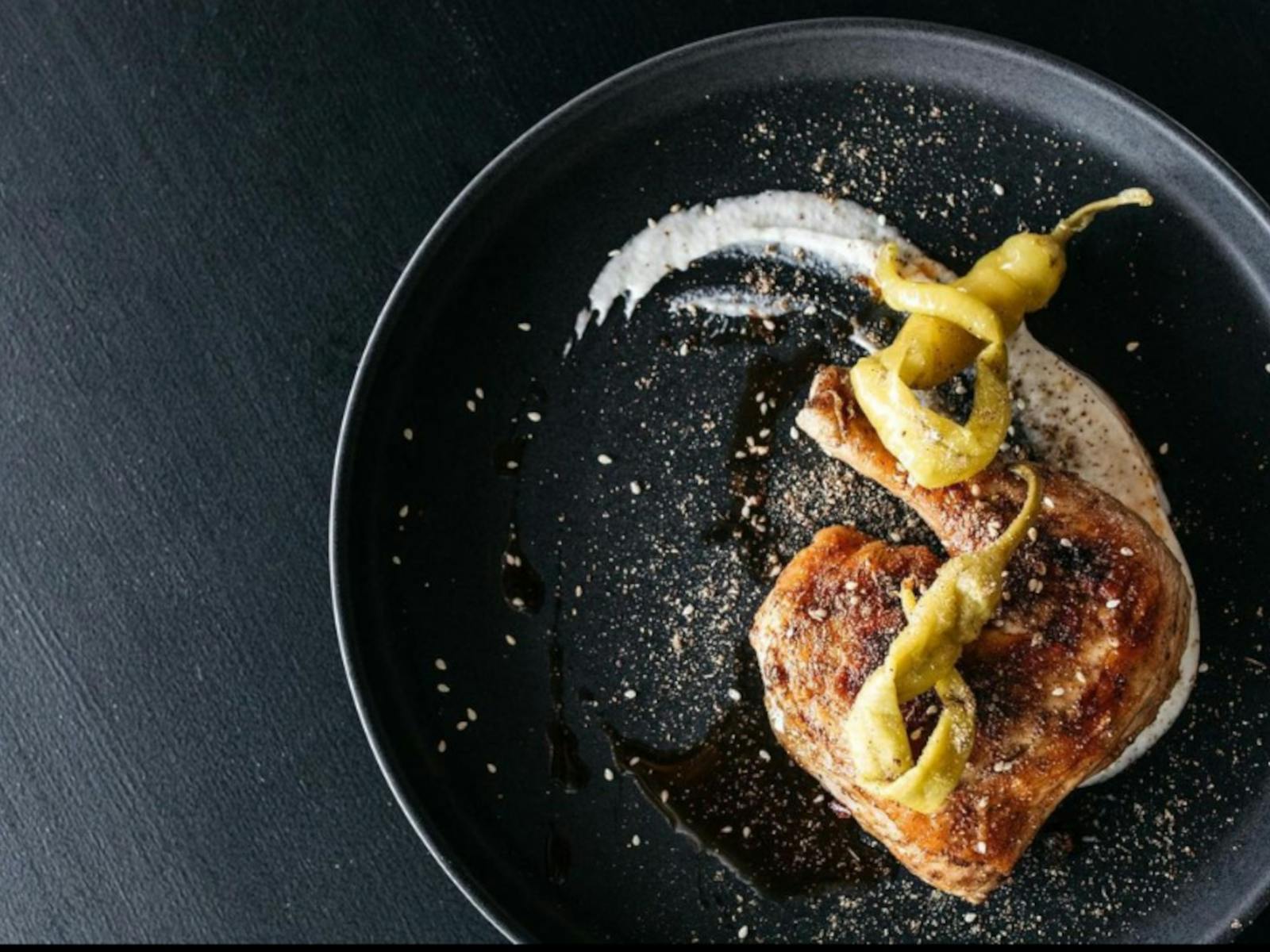 delicious food on a black plate at Baraka