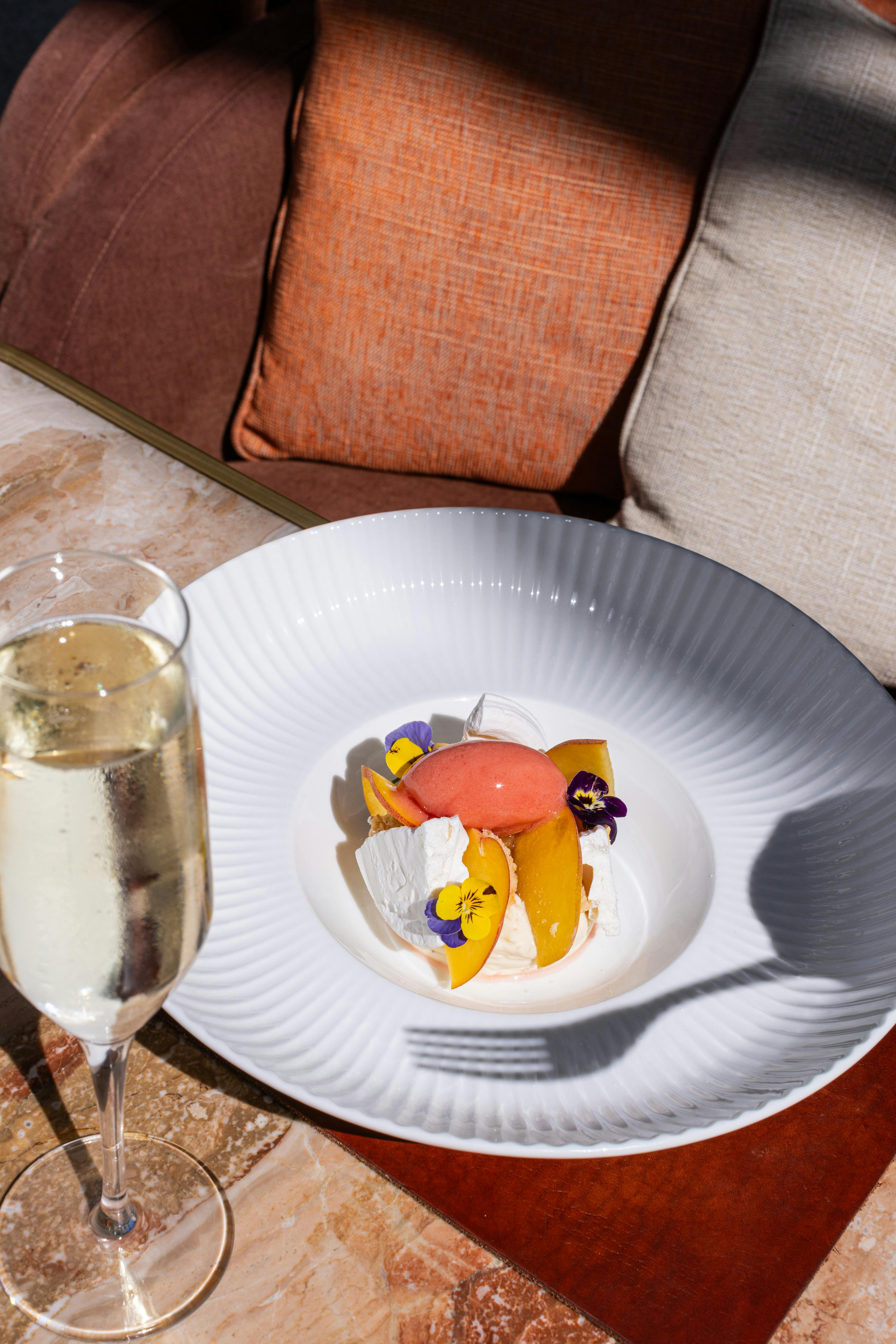 Modern dessert plated with accompanying champagne