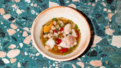 blue eye in broth with sun dried tomatoes and beans