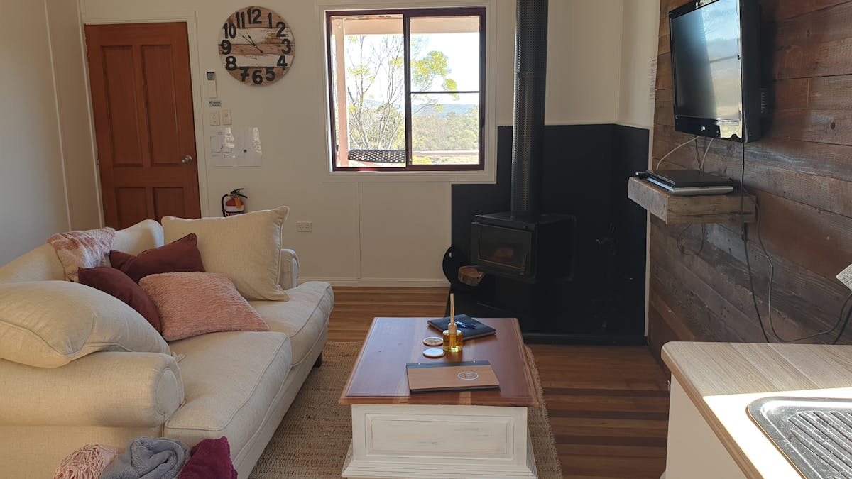 Cosy lounge area with tv and log fireplace