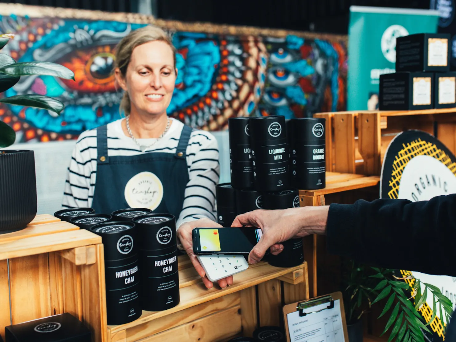 A woman selling products at a stall.