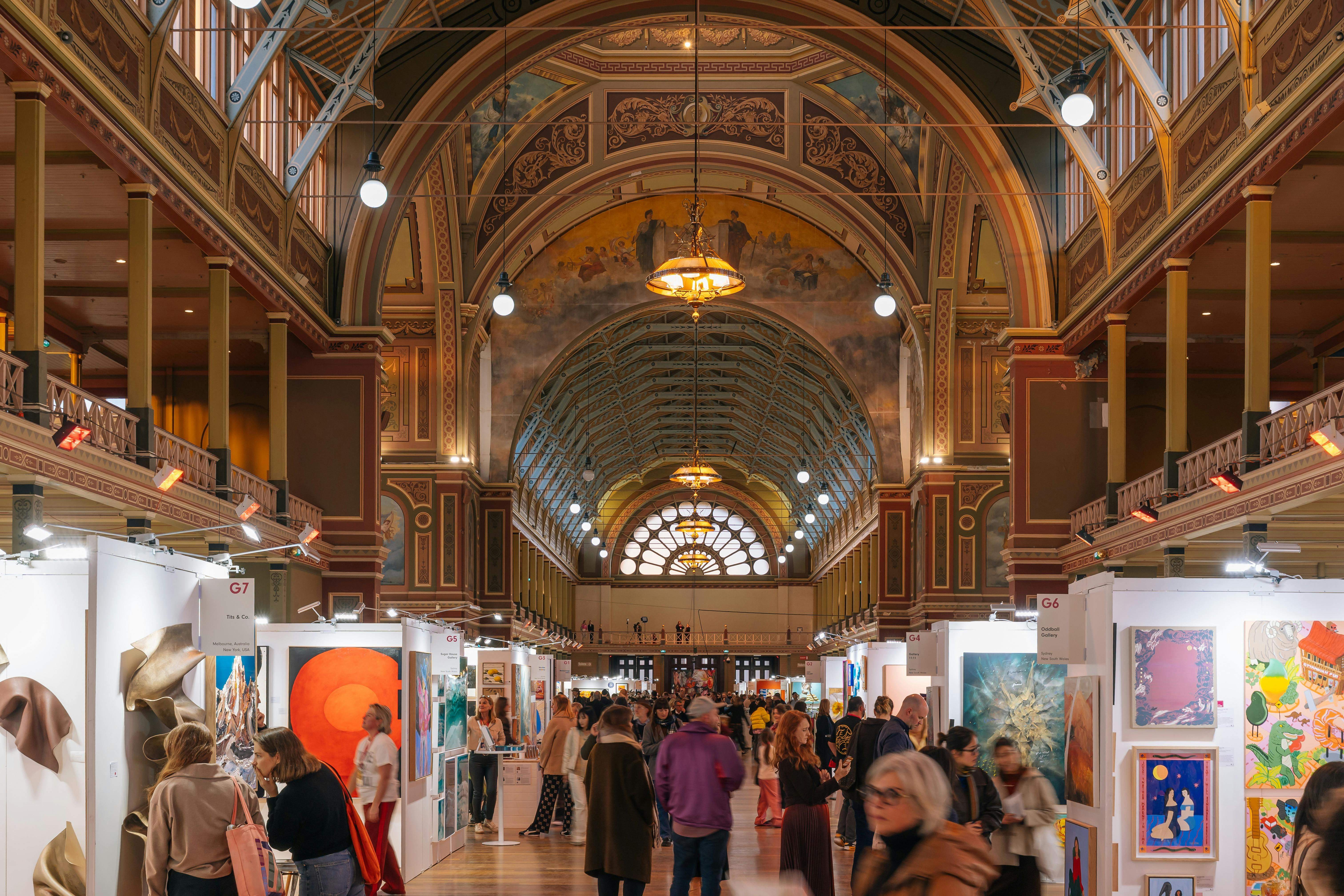 Image of visitors walking through the exhibition building