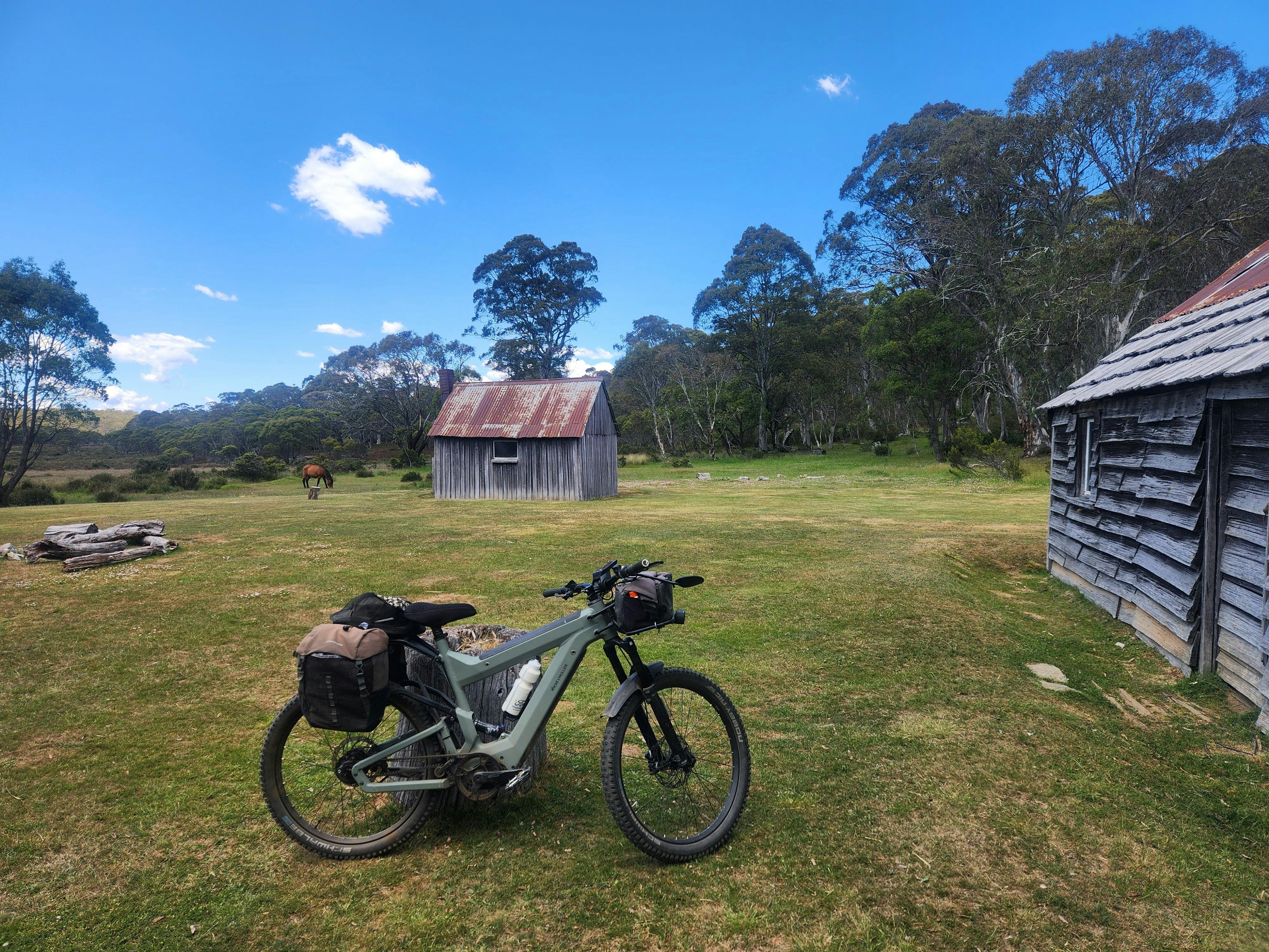 Bike pictured at a historical Hut at Tantangara