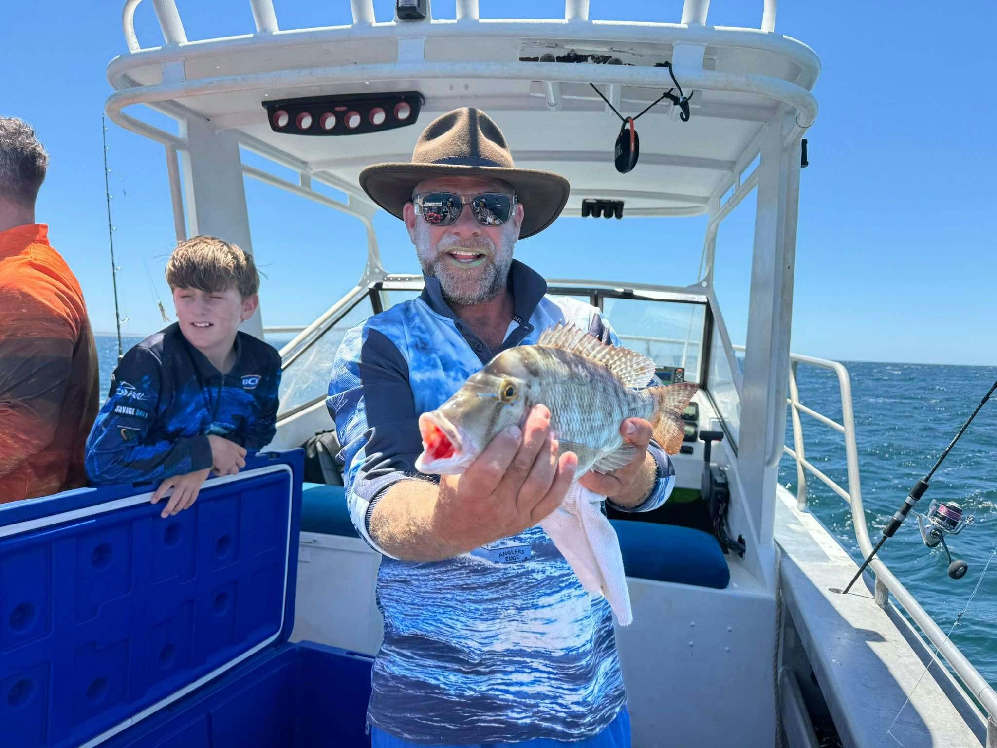 holding black snapper
