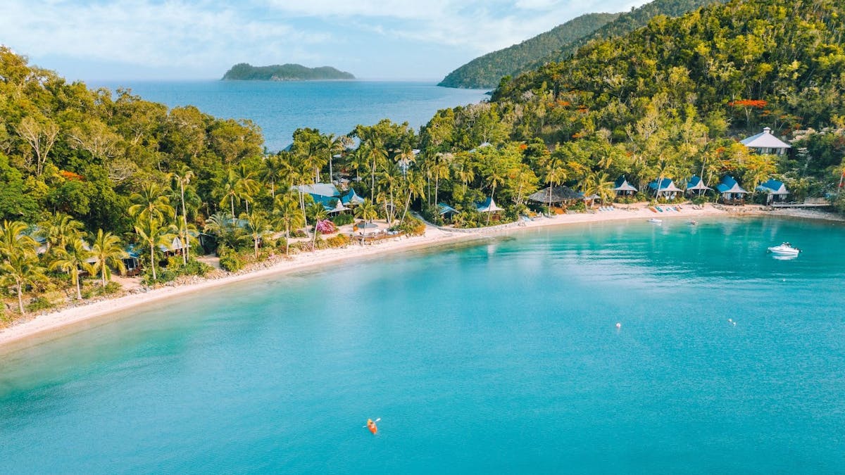 Wide shot of island with beach.