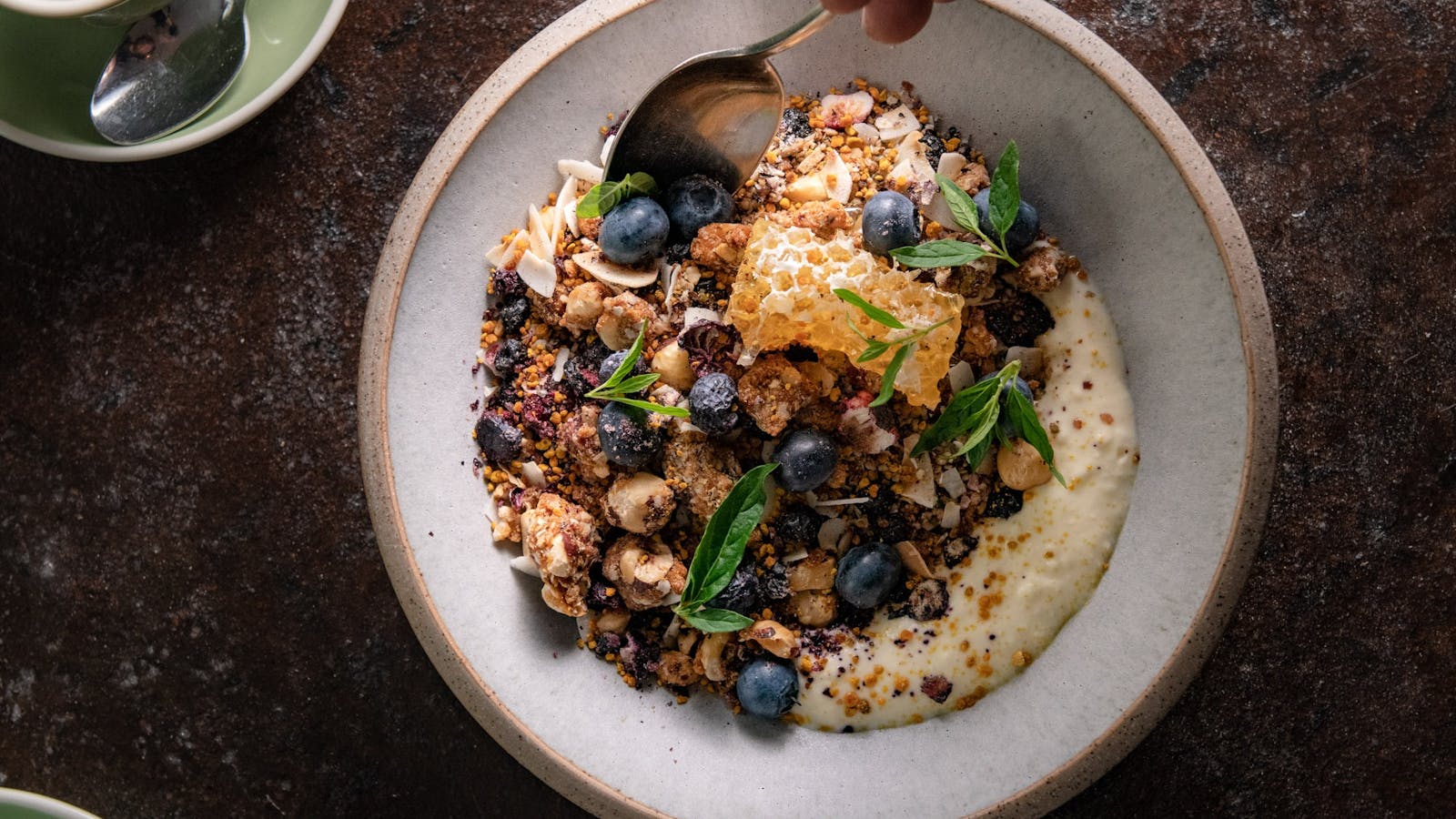 House made granola with seasonal fruit and coconut yoghurt