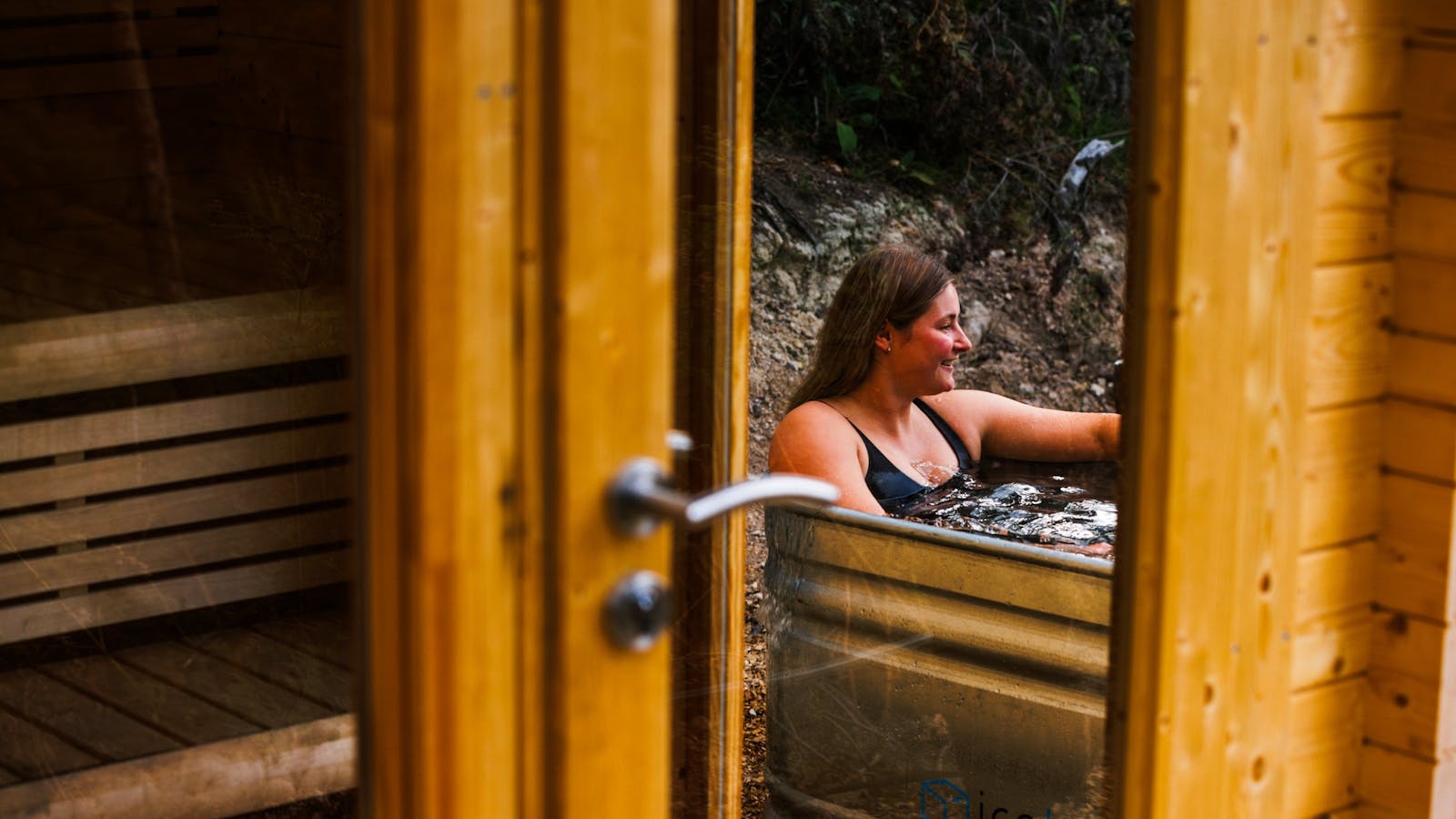 A photo of a woman enjoying a cold plunge