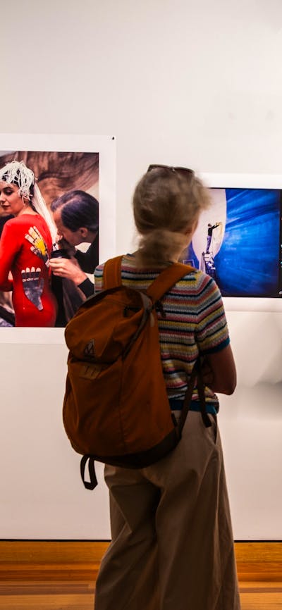 Two people exploring the exhibition A Total Work of Art: Sidney Nolan and the Stage