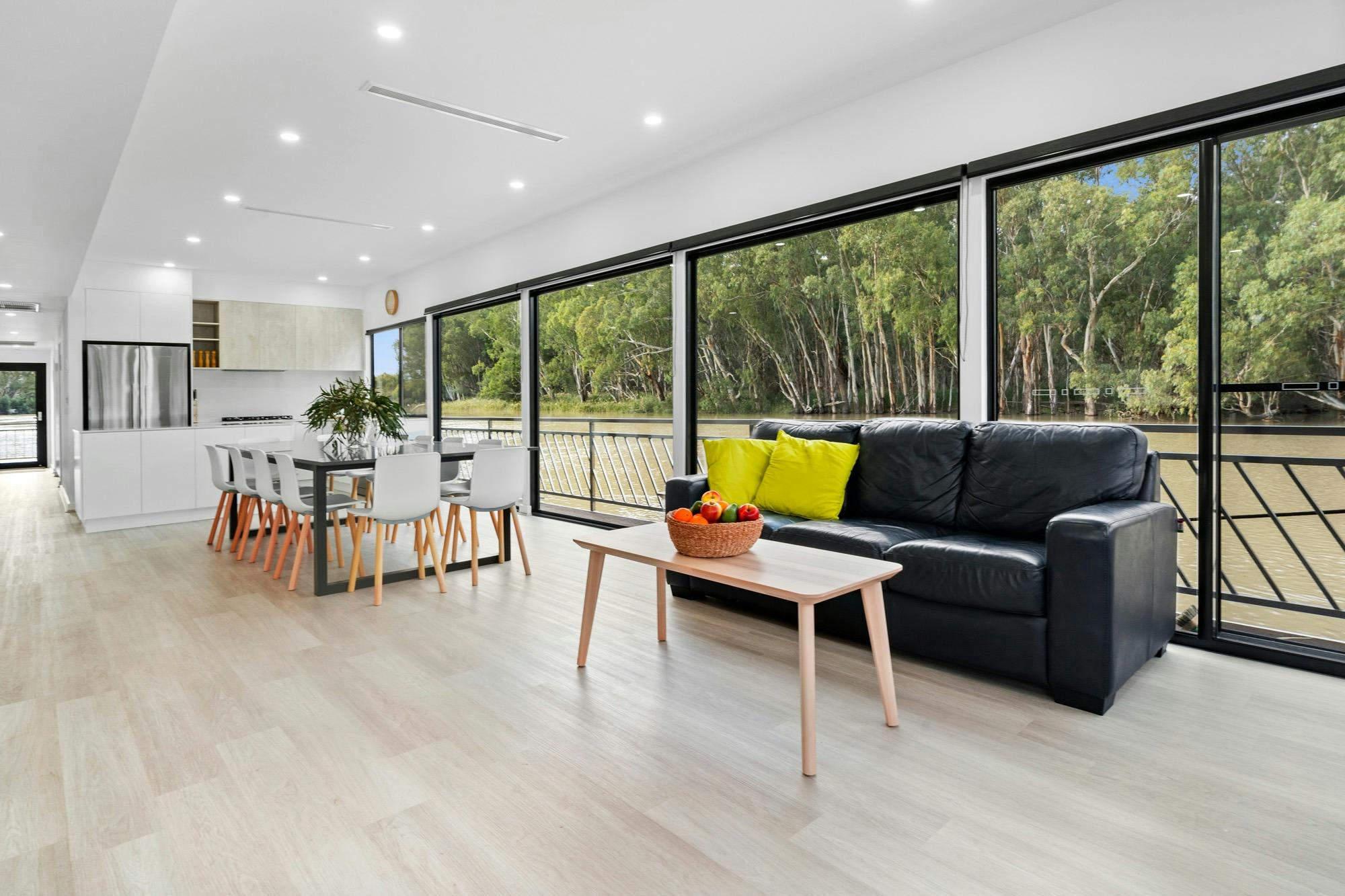 interior of luxury houseboat looking from Living area to kitchen