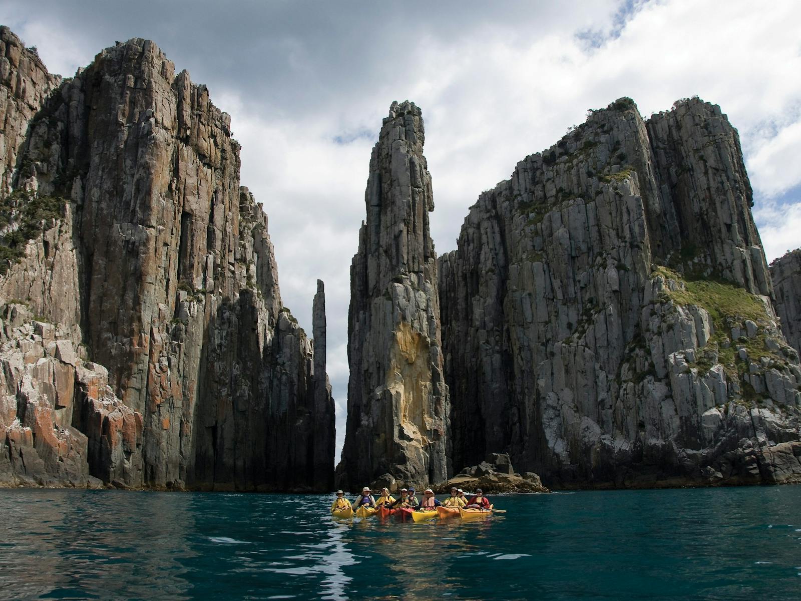 Kayakers outside the Totem Pole and Candlestick rock formations, Tasman National Park