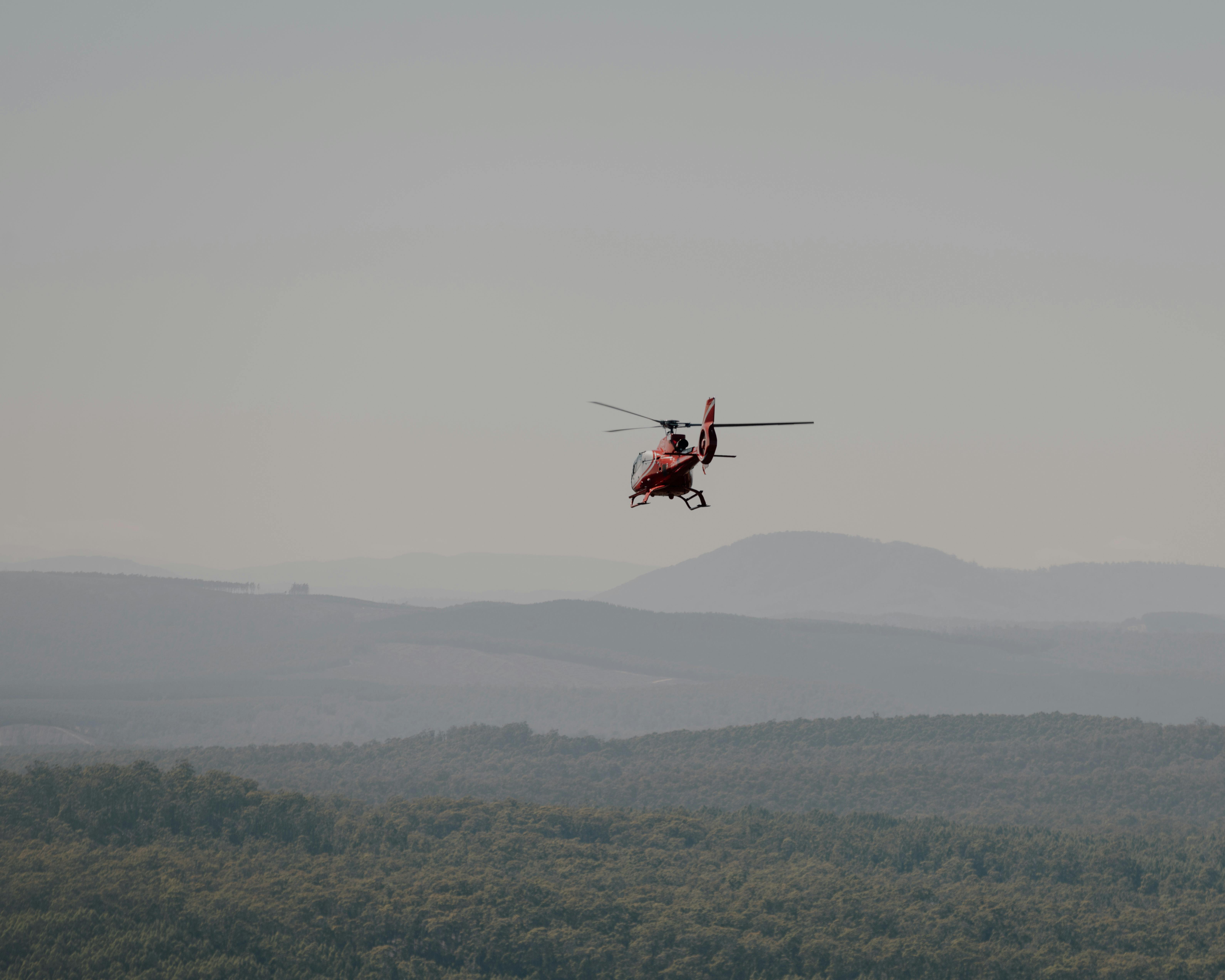 EC130 (red) flying into distance