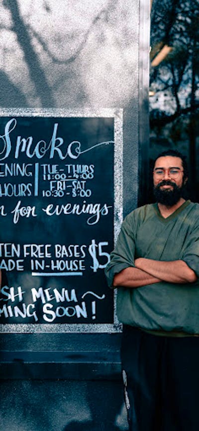 Owner and sister (Kavita) with outdoor hand painted signage