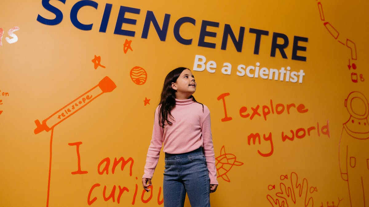 Young girl walking into Sciencentre