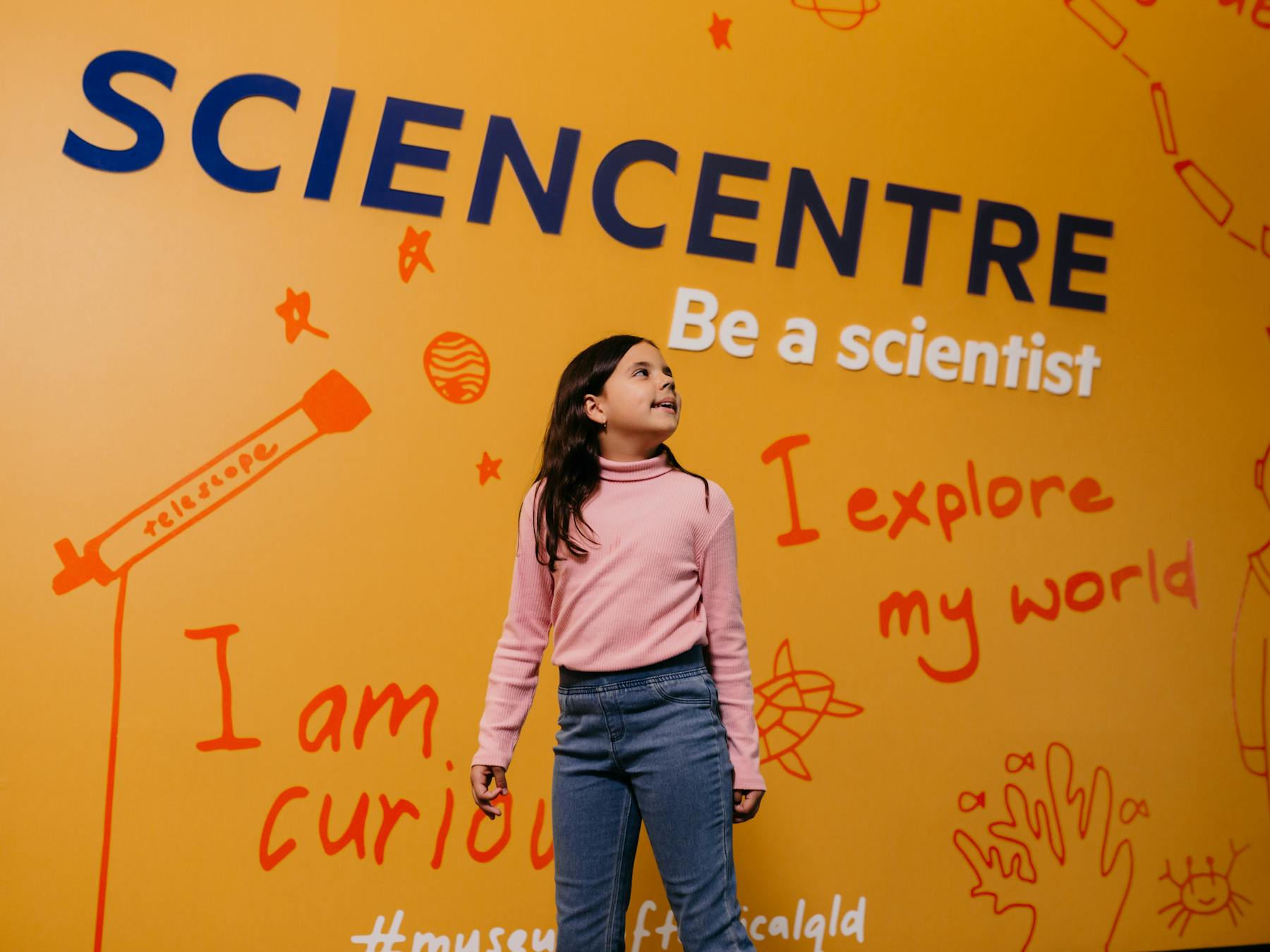 Young girl walking into Sciencentre