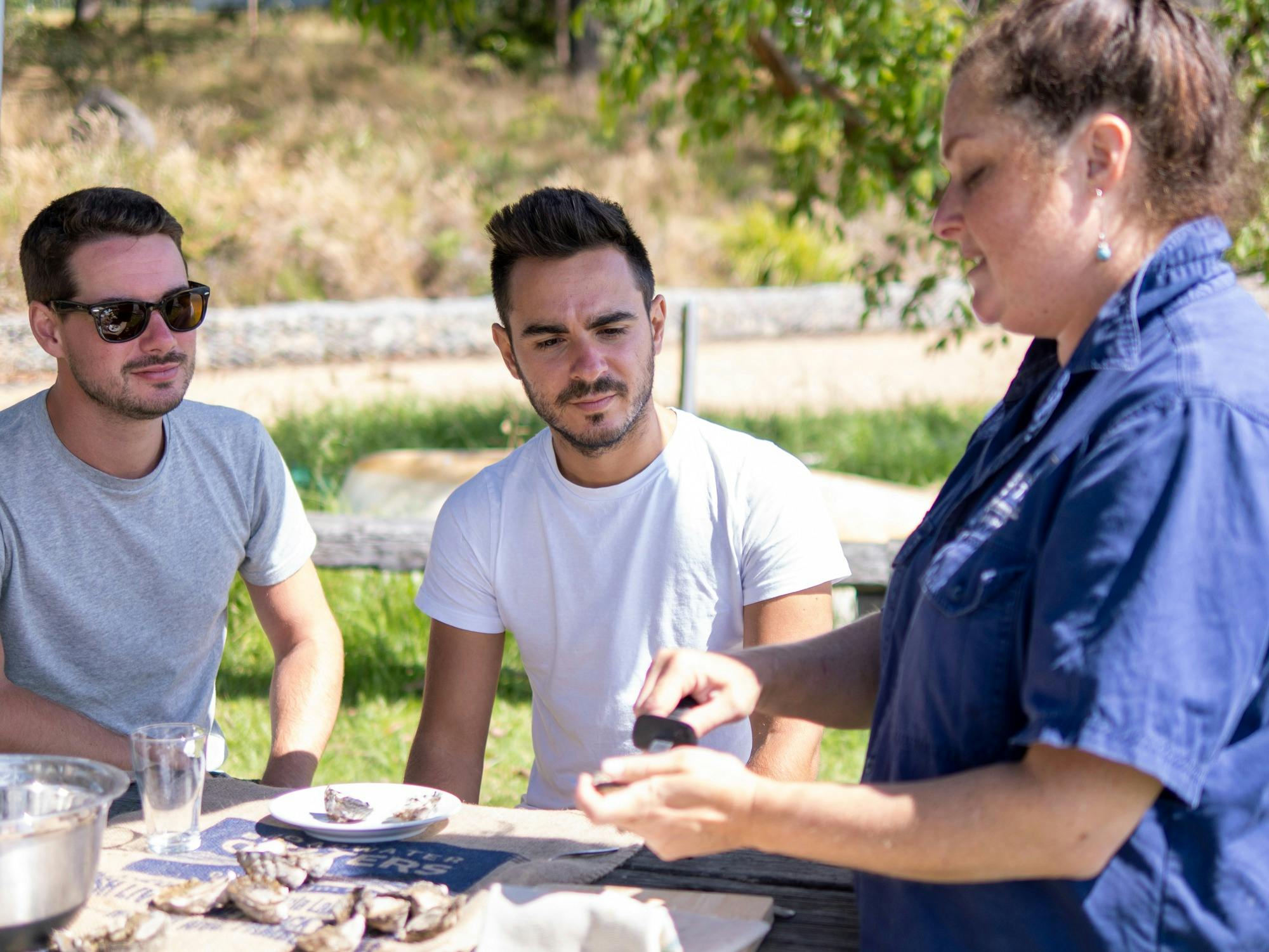 two guests looking at oysters