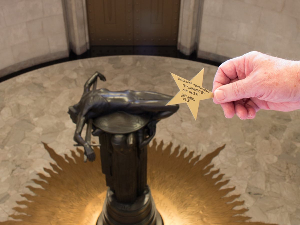 Casting a star during the Service of Remembrance