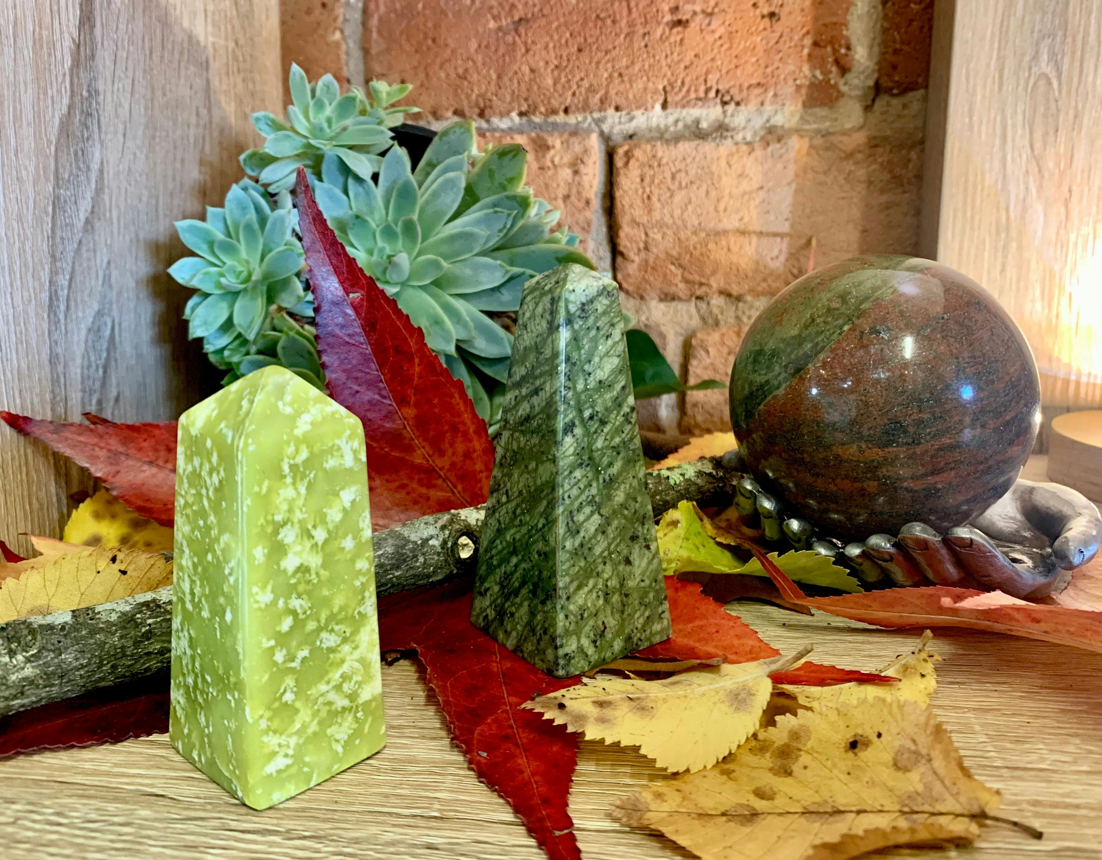 Two crystal towers with a red and green sphere.