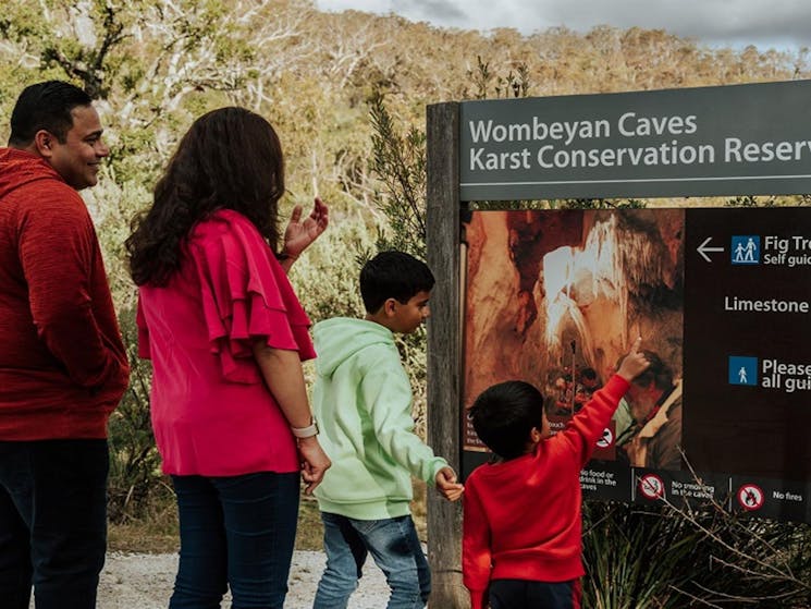 Visitors follow signs to Fig Tree Cave on a self-guided tour. Credit: Remy Brand/DPE &copy; Remy