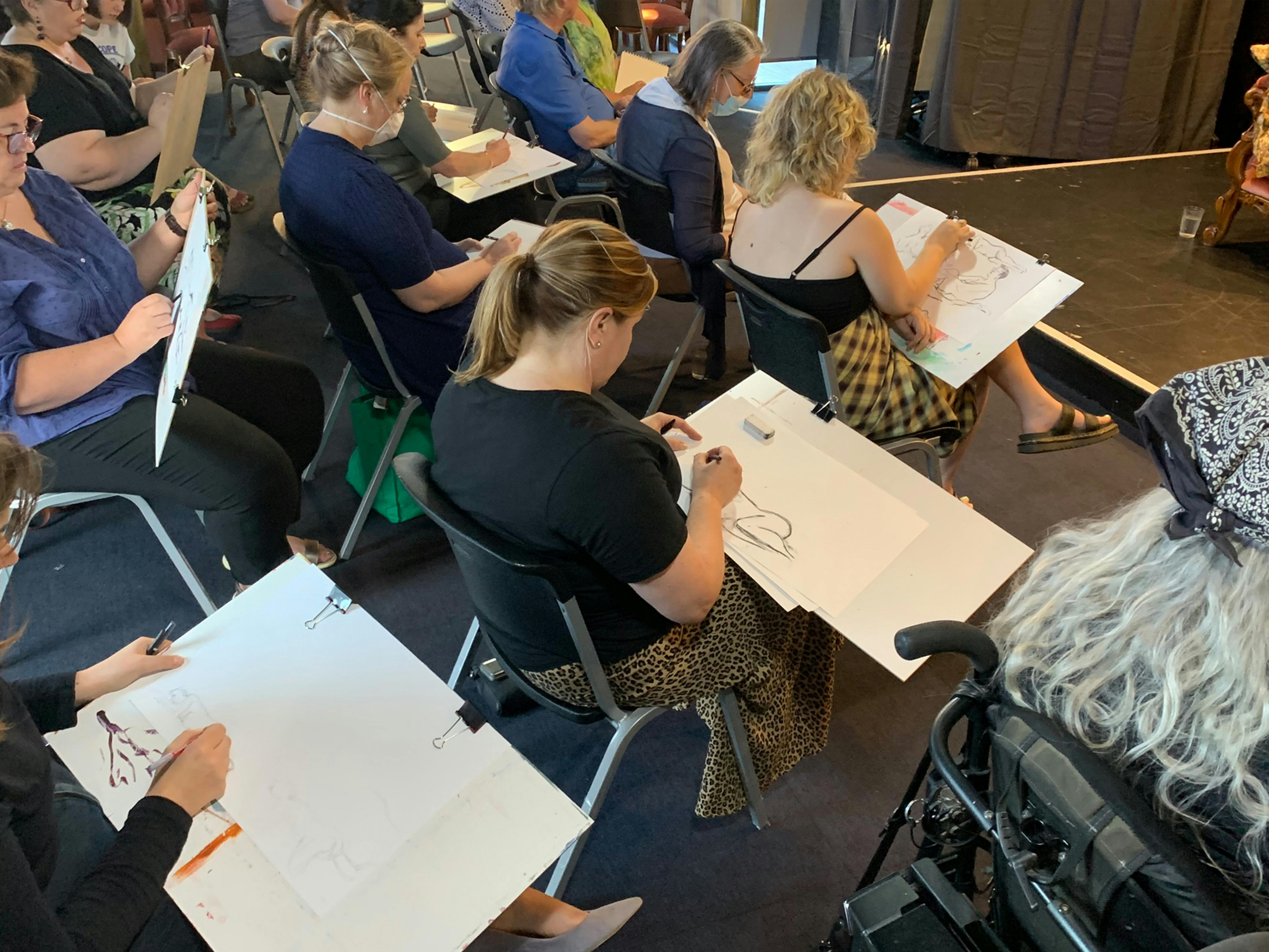 Photo of people creating life drawings