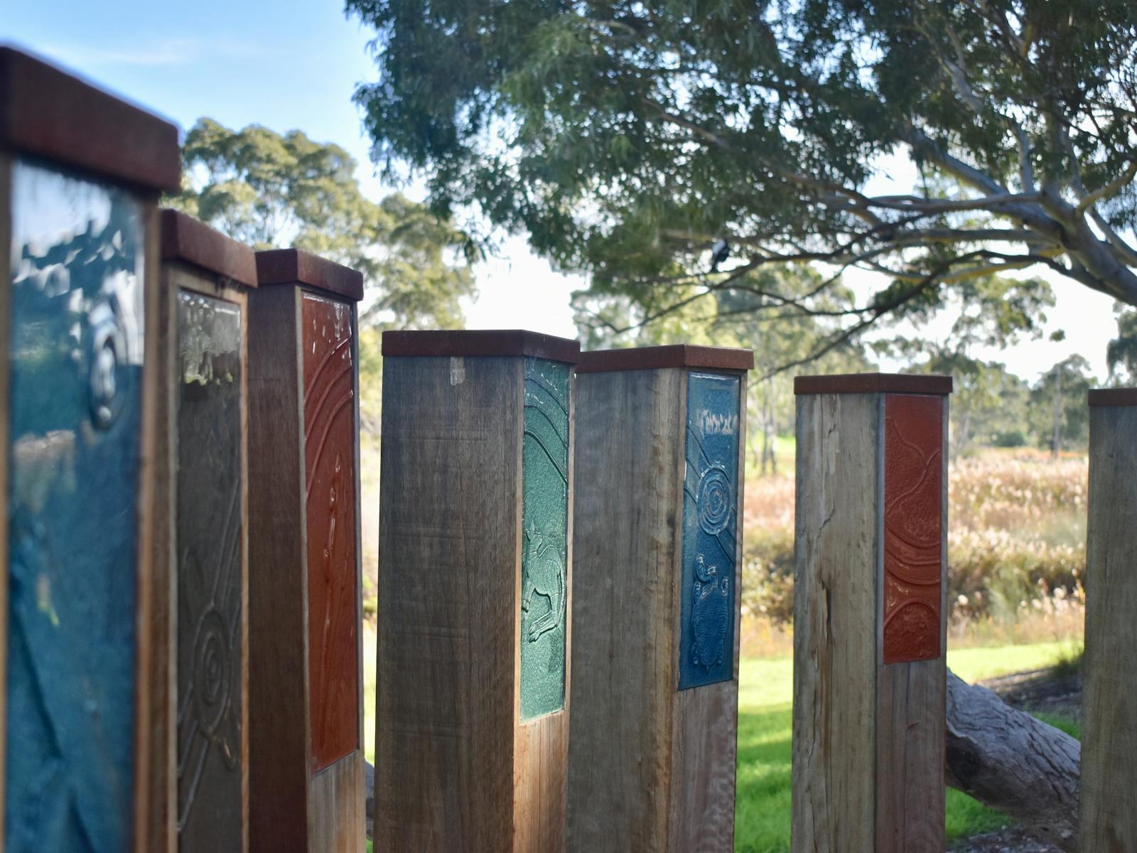 Seven Wathaurong Glass-inlaid wooden bollards. A nod to our indigenous land owners.