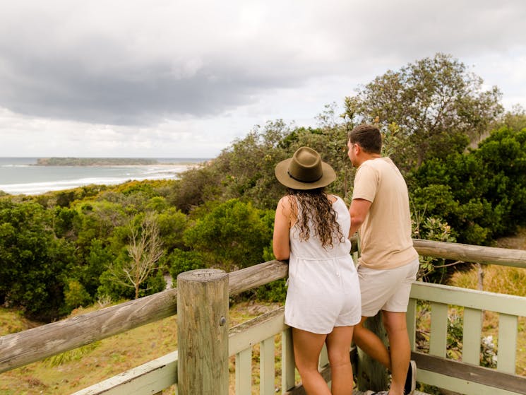 A lady and a man enjoying views at a lookout