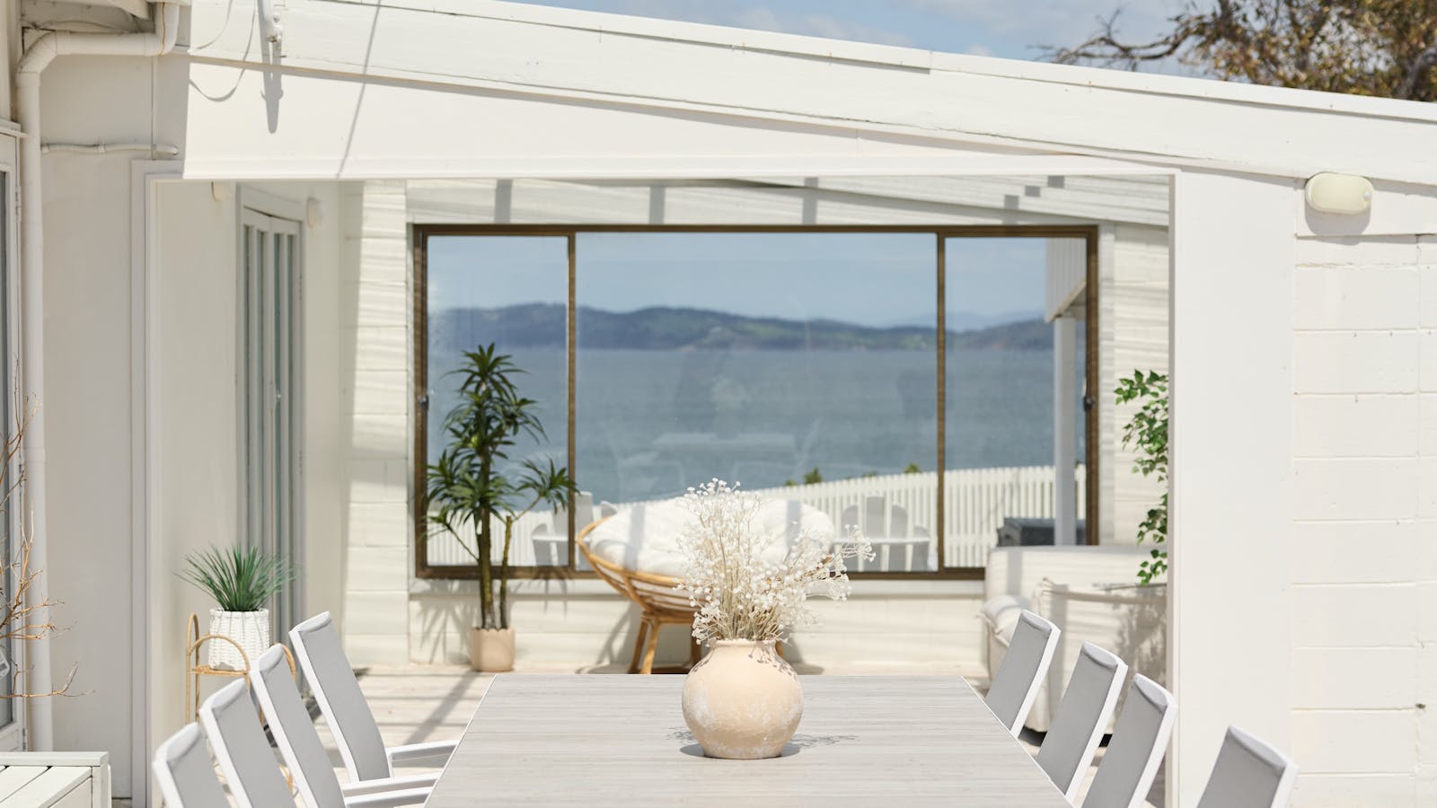 Spacious outdoor dining with ocean views, perfect for gatherings and scenic meals