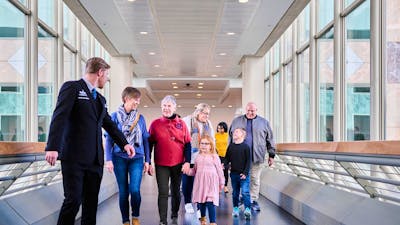 A group of people walking forward