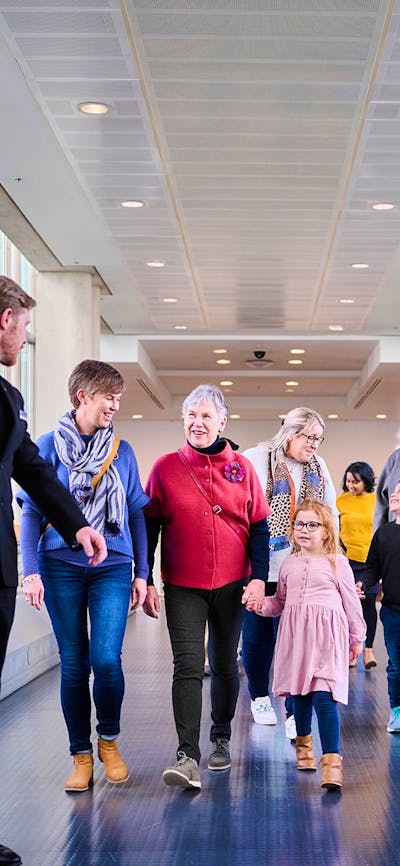 A group of people walking forward