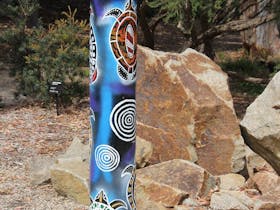 Dreaming Poles at George Pentland Botanic Gardens are a series of 8 artistic totem poles created by