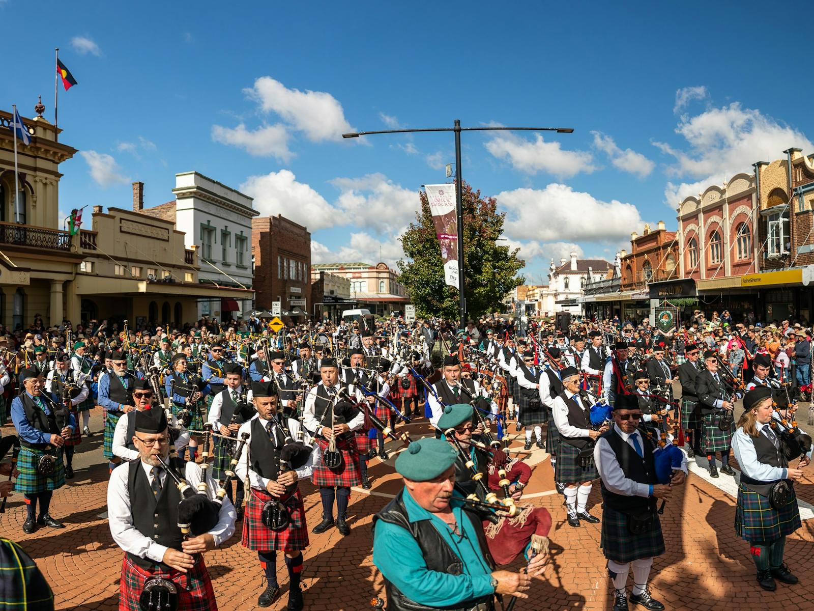 Massed pipe bands at festival's street parade