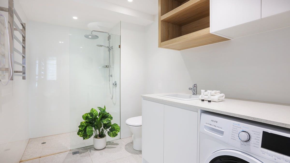 Shared bathroom with shower, toilet, laundry and dryer - Seacrest 11A Gold Coast Holidays