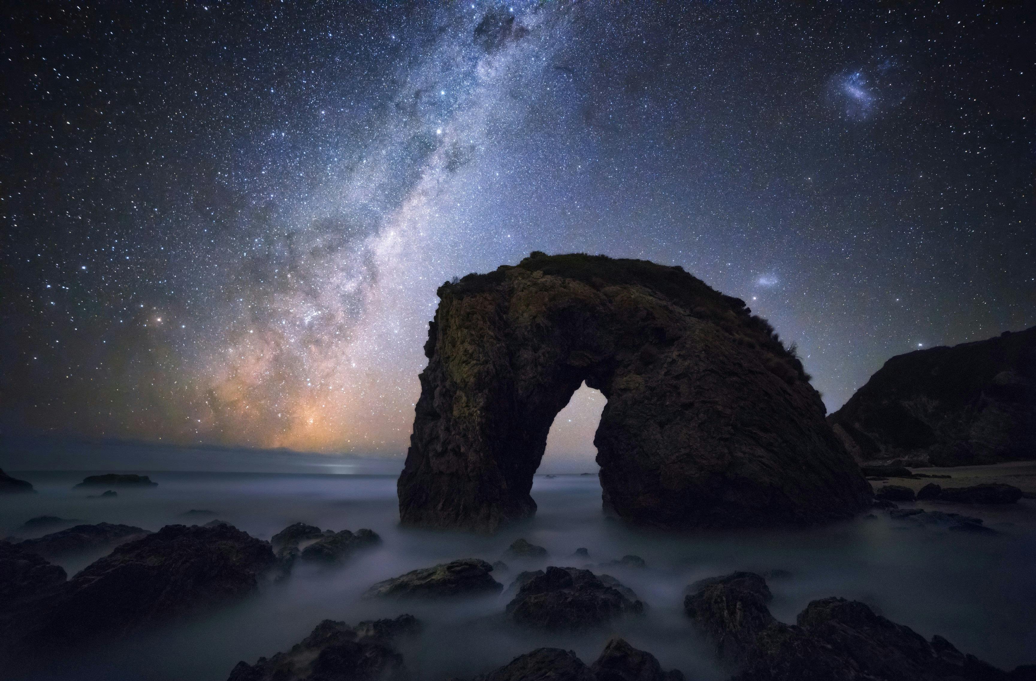 Stars and the Milky Way shining over Horse Head Rock, Bermagui