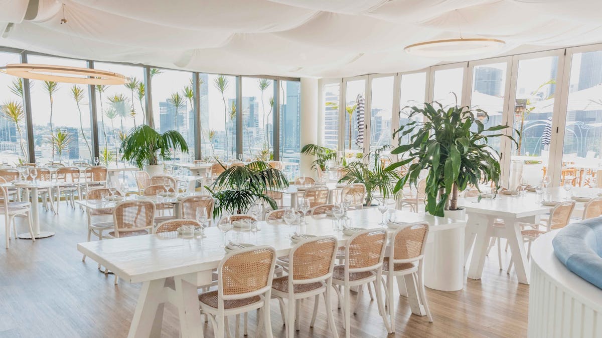 indoor restaurant, white and blue interior, mediterranean inspired, natural lighting