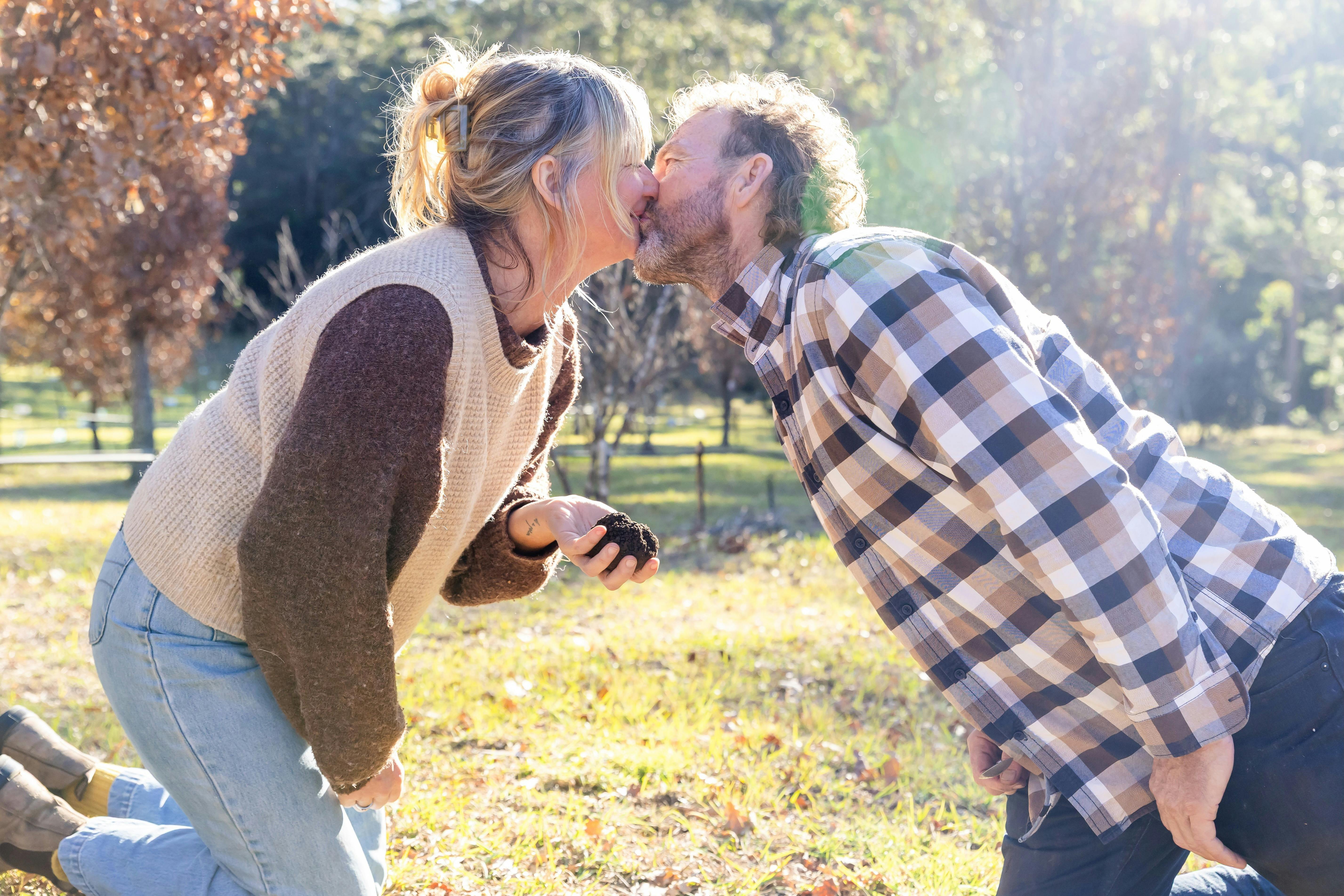 A couple kissing after finding truffle