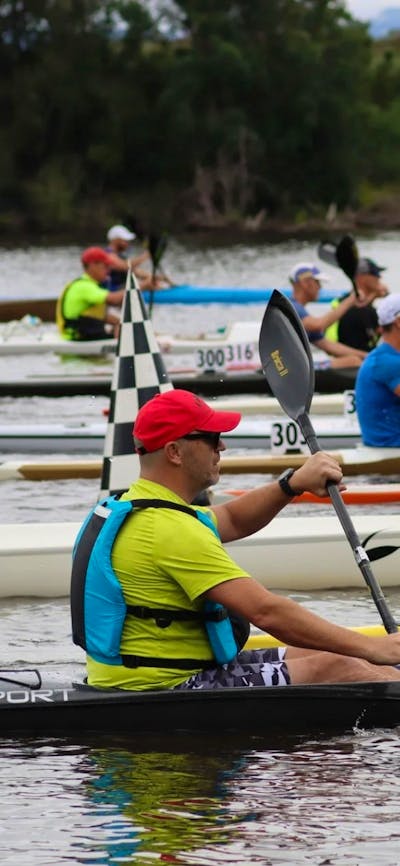 Kayakers are lined up along a