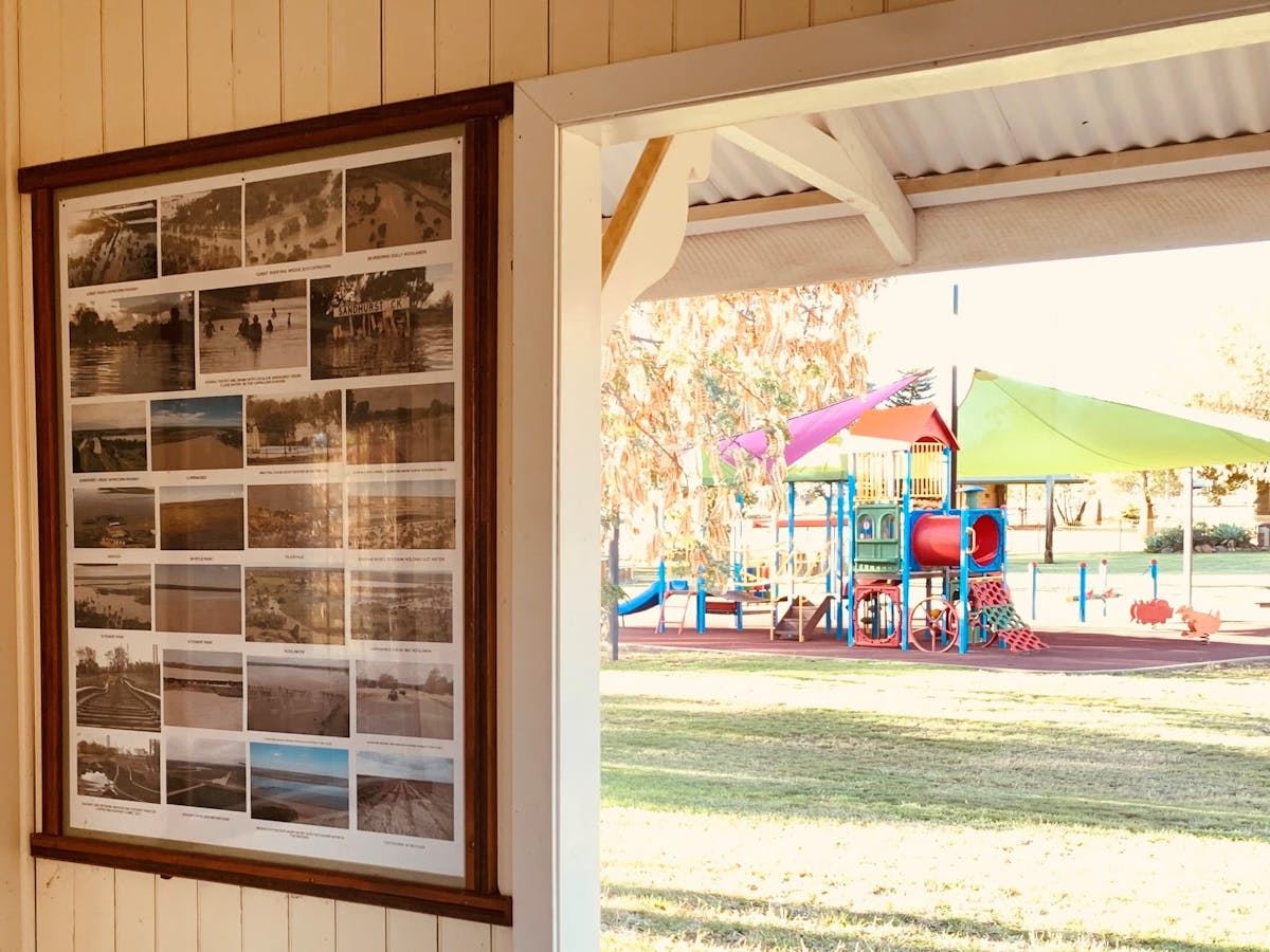 View of playground at Whistle Stop Park from inside historical  railway station