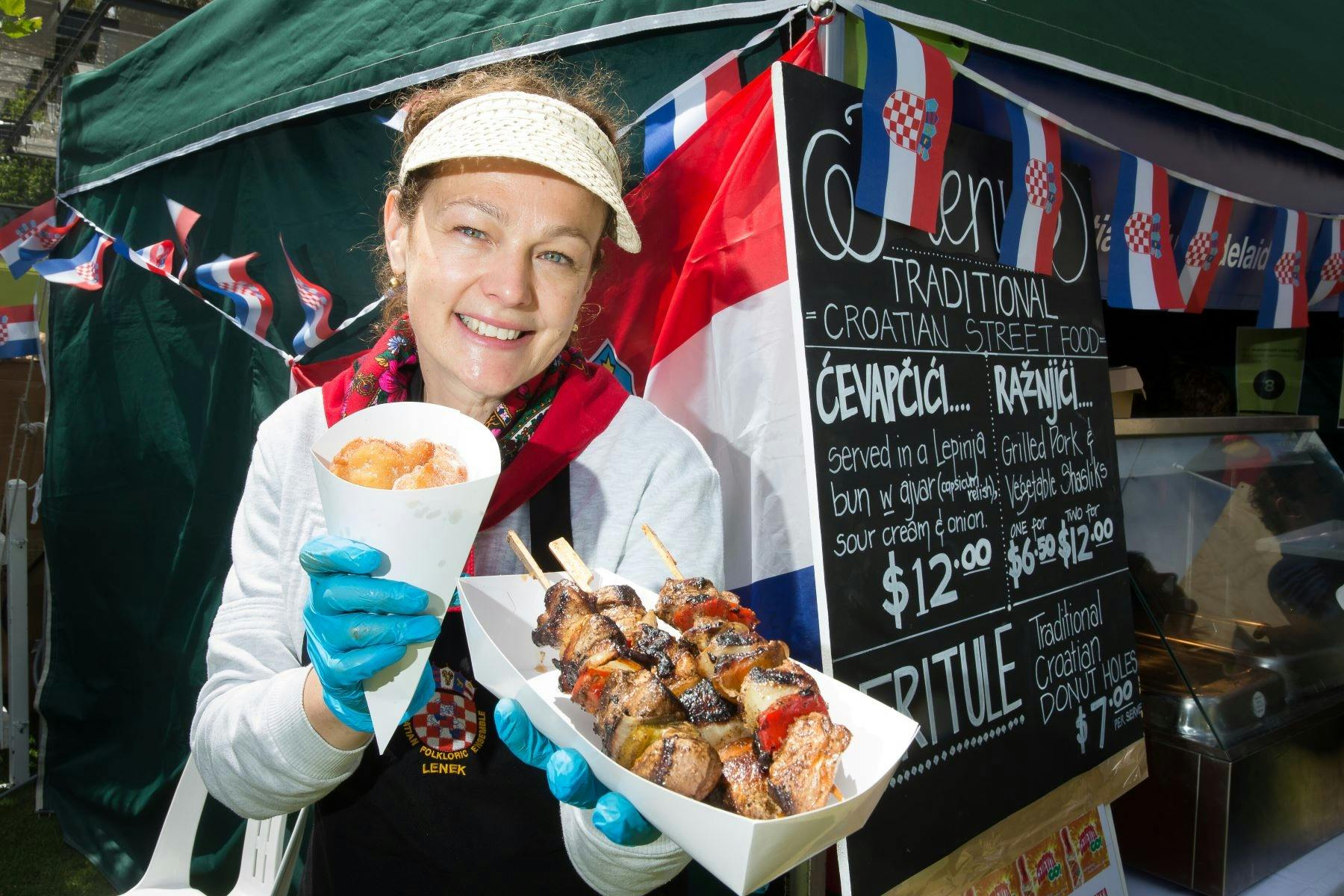 Women showing Croatian food from their stall at the Multicultural Festival