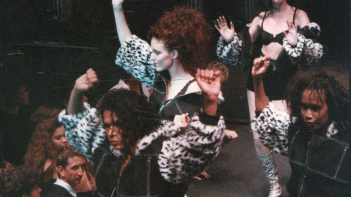Models walk in a fashion parade in the early 1990s wearing outfits designed by Glamourpussy