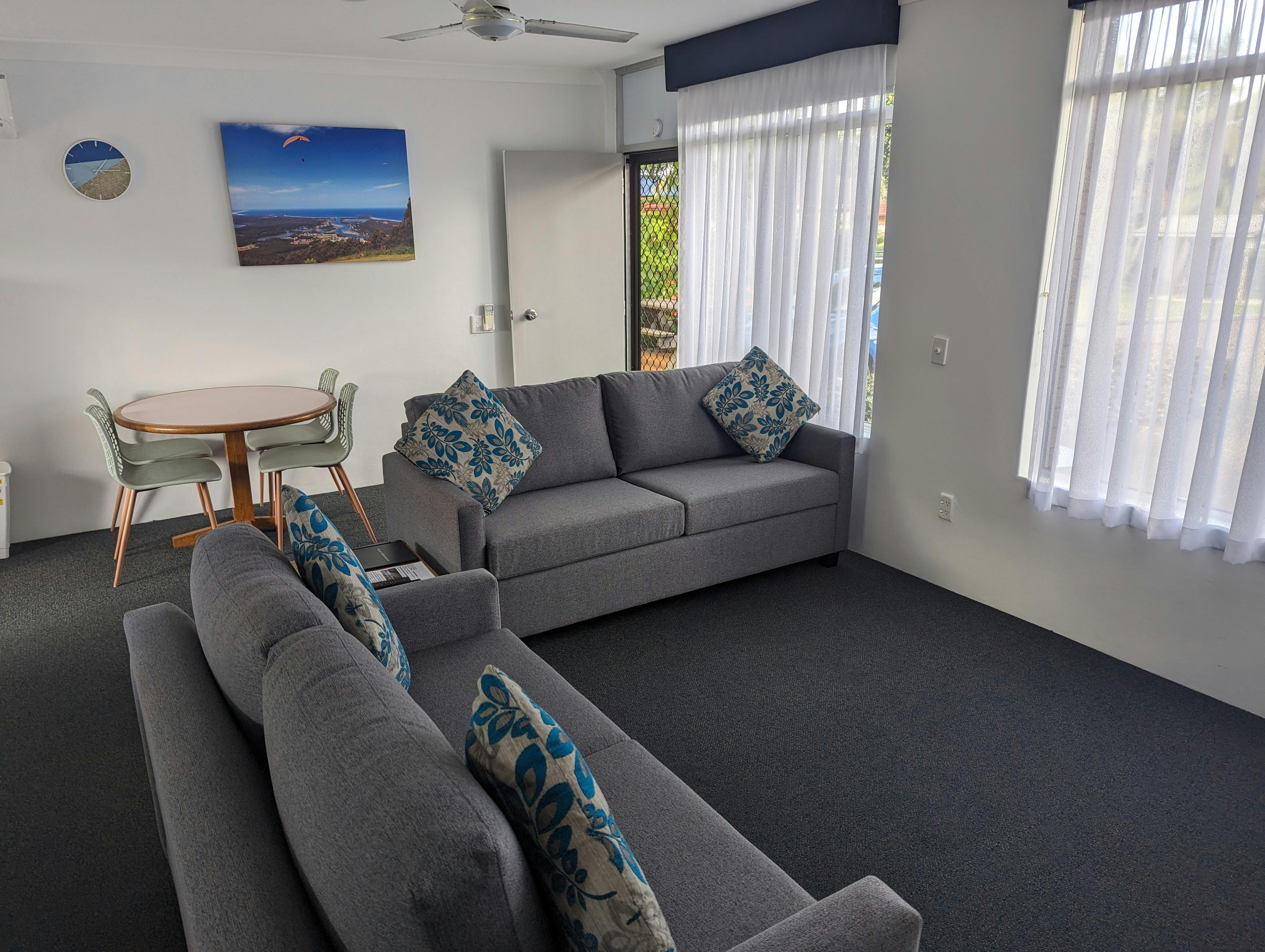 Two Bedroom Apartment lounge area. One 2 seater sofa and one 3 seater sofa - bed.