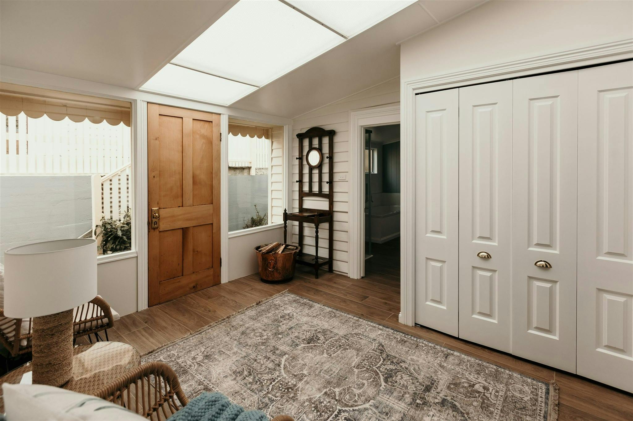 Light and airy entrance way, enclosed laundry, extra firewood, seating in the sun, modern