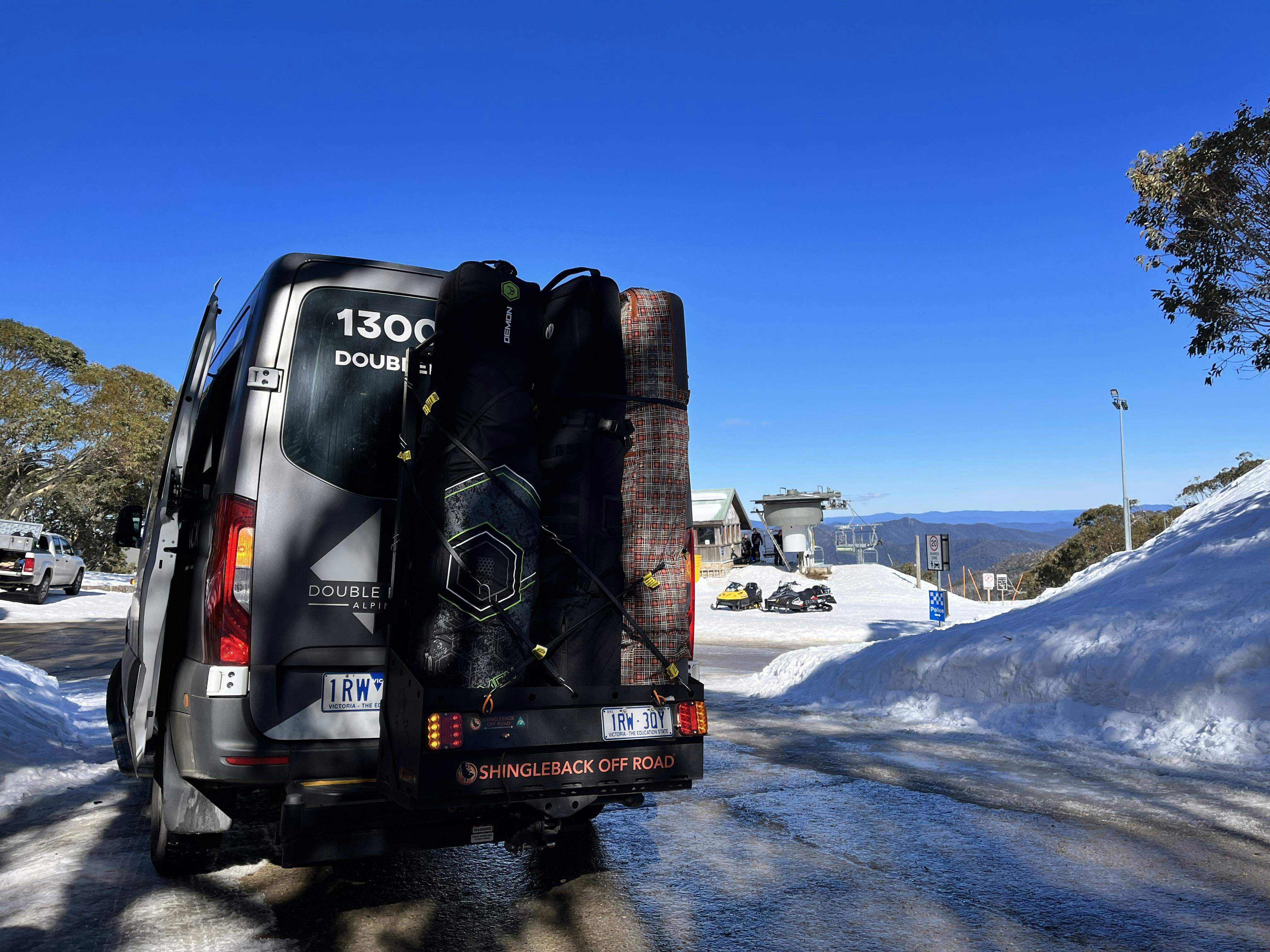 Skis loaded into Double Black Alpine carrier, set for snow, sunshine, and adventure on Mount Buller.