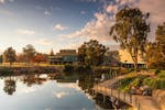 Early morning light over the wollundry lagoon, boardwalk and civic theatre