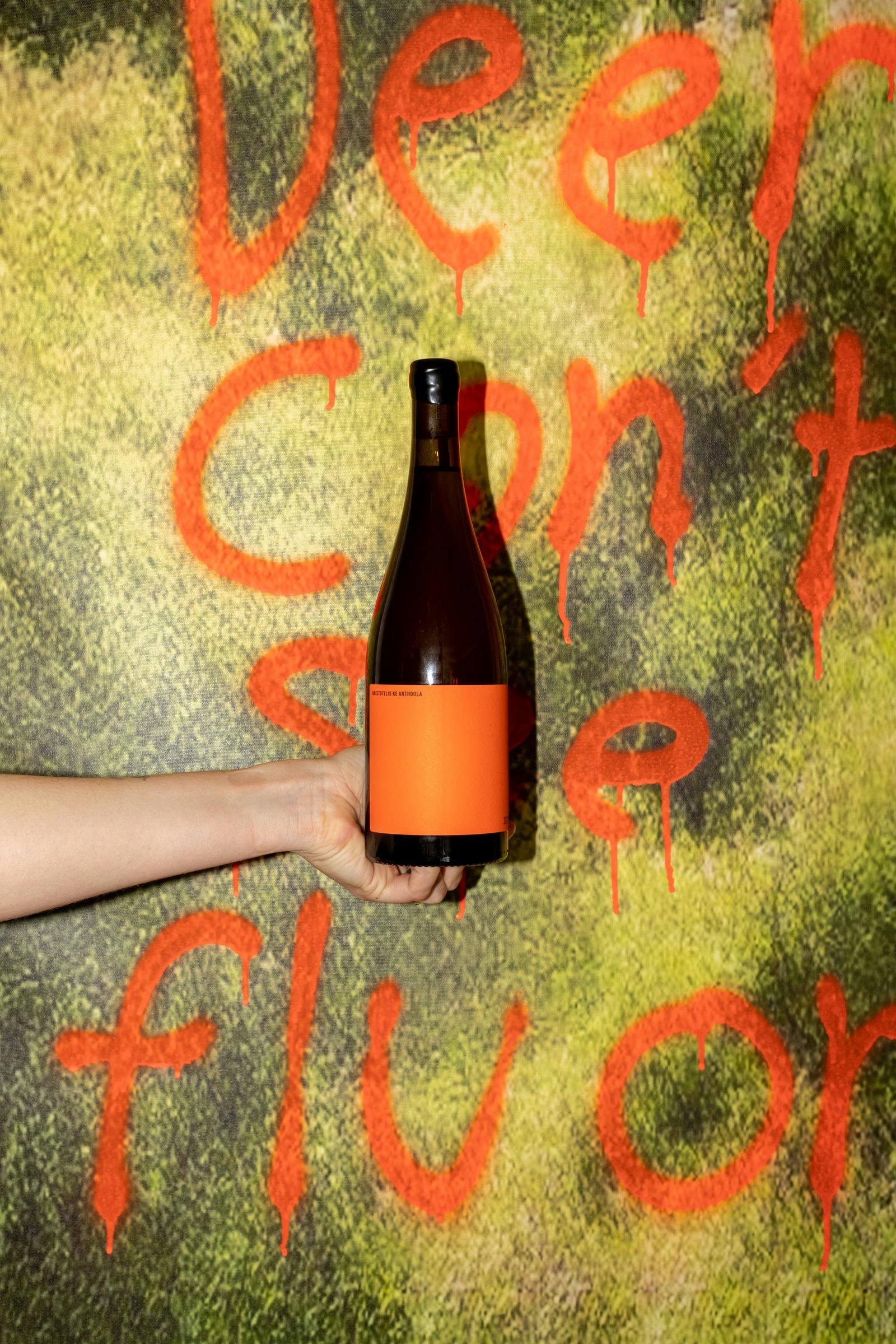 wine bottle over artowrk